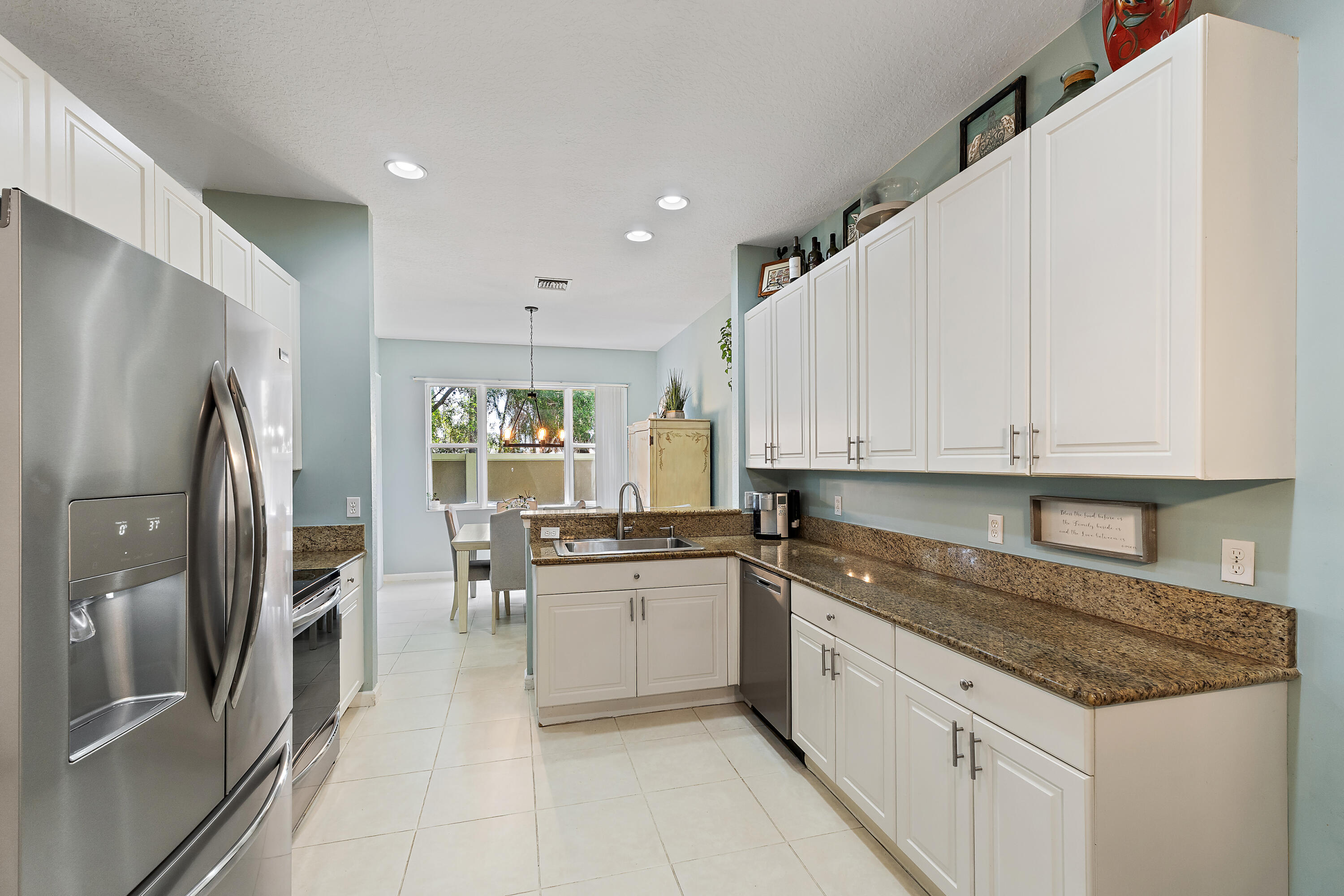 Located in the gated community of Newport Isles in Port St. Lucie, this well-maintained 3BR + loft home offers comfort, space, and convenience just minutes from Tradition Square with easy access to I95. Bright open-concept living, dining, and kitchen areas are filled with natural light—ideal for both everyday living and entertaining. The kitchen features granite countertops and stainless steel appliances. Upstairs includes a spacious primary suite, two additional bedrooms, and a versatile loft. Enjoy resort-style amenities including a pool, fitness center, tennis and basketball courts, and sidewalks throughout. A great opportunity in one of Port St. Lucie's most desirable communities near Tradition.