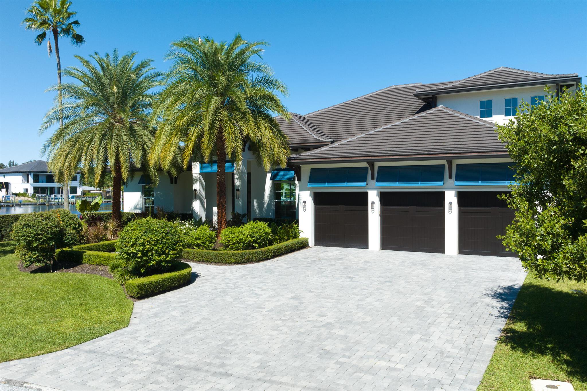 Call for private viewing, Gorgeous 2019 Construction Corner Lot located on the water in Pirates Cove.  Breathtaking masterpiece with versatile modern open space floor-plan in the heart of PBG just off PGA Blvd.  Boasting over 259' of Seawall, beautiful wide water views of large bay.  Spacious floor plan includes a Master on first with wet bar. Luxurious features throughout home includes Dbl Pane Low E Impact Windows, The state-of-the-art Dream Kitchen, 9' oversized island, 48'' 6 burner Gas stove, 3 ovens, Stand alone freezer and fridge all overlooking the impressive 40'X43'. Great Room with views beyond, Oversized 3 Car Garage & Xtra Storage. Brand newWater filtration system & Electric Car charger in Garage. Sauna included. Dock for multiple combinations of Large Boats/yachts & PWC, no fixed bridges with Intracoastal access.
