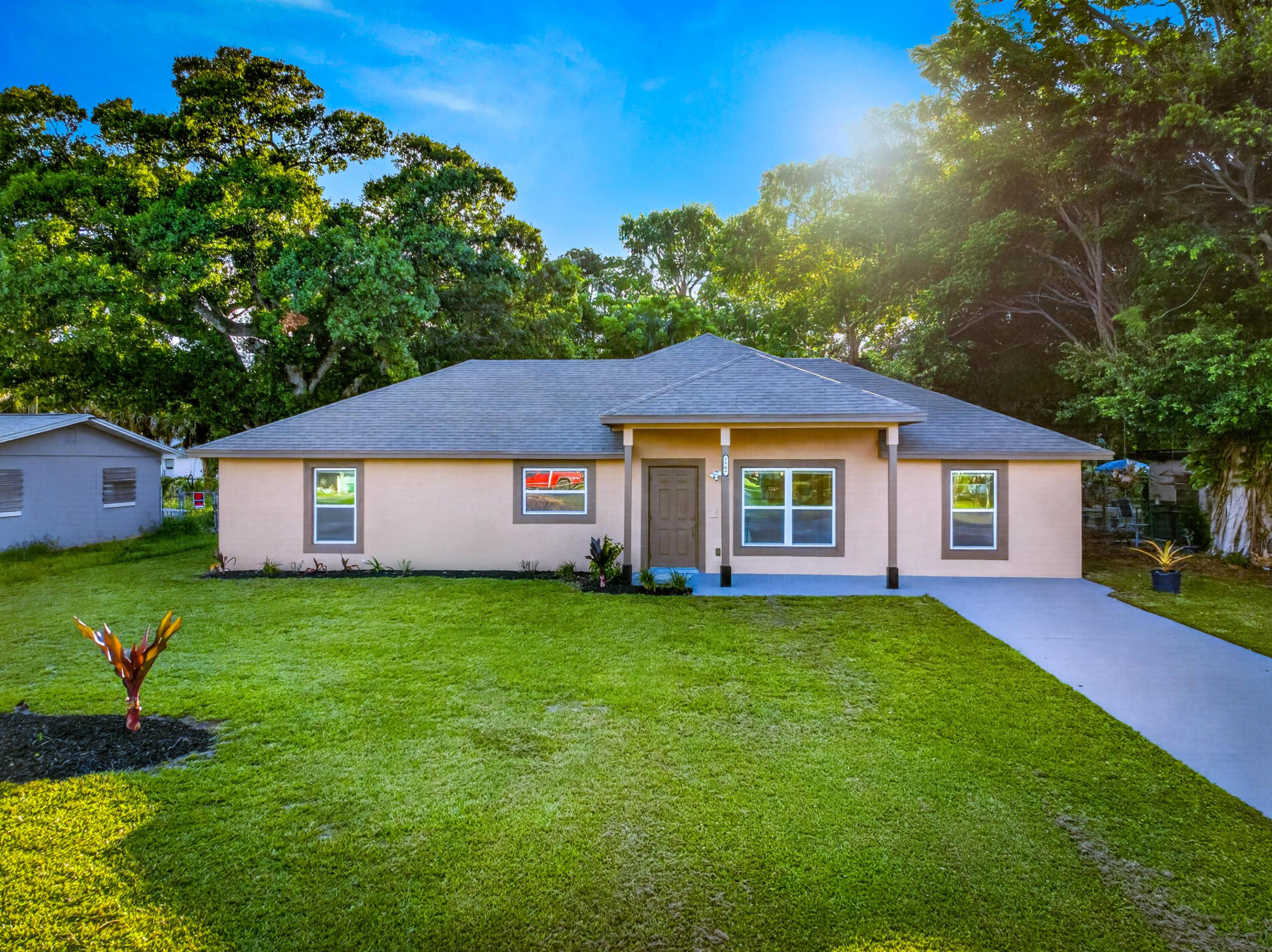 Completely transformed from top to bottom, this stunning 5-bedroom, 4 full-bath CBS home offers the rare opportunity to own what feels like a brand-new home without the new construction wait. Thoughtfully redesigned with modern finishes and quality craftsmanship throughout, everything has been redone within the last 2 years - truly all new everything!  Step inside and immediately appreciate the bright, open-concept layout highlighted by oversized polished tile flooring in the main living spaces, luxury vinyl flooring in the bedrooms, recessed lighting, fresh drywall, contemporary paint selections, and abundant natural light. The beautifully remodeled kitchen serves as the centerpiece of the home with expansive granite countertops, sleek gray cabinetry, stainless steel appliances,  modern lighting, and a layout designed for both everyday living and entertaining.  The spacious living areas create a clean, modern aesthetic. The primary and additional bathrooms have been fully updated with stylish finishes and a fresh contemporary feel.  Major improvements completed within the last year include new flooring, drywall, electrical, plumbing, roof, septic system, windows, interior and exterior paint, appliances, fixtures, and more, giving buyers peace of mind and years of worry-free ownership.  Situated on a spacious lot in Fort Pierce, this property offers convenient access to everything the Treasure Coast lifestyle has to offer, including beautiful beaches, shopping, dining, and entertainment. Enjoy being just a short drive from Fort Pierce Inlet State Park, Hutchinson Island beaches, historic Downtown Fort Pierce waterfront dining and shopping, parks, marinas, and everyday conveniences. Fort Pierce is known for its coastal charm, waterfront attractions, and access to outdoor recreation throughout the Treasure Coast region.