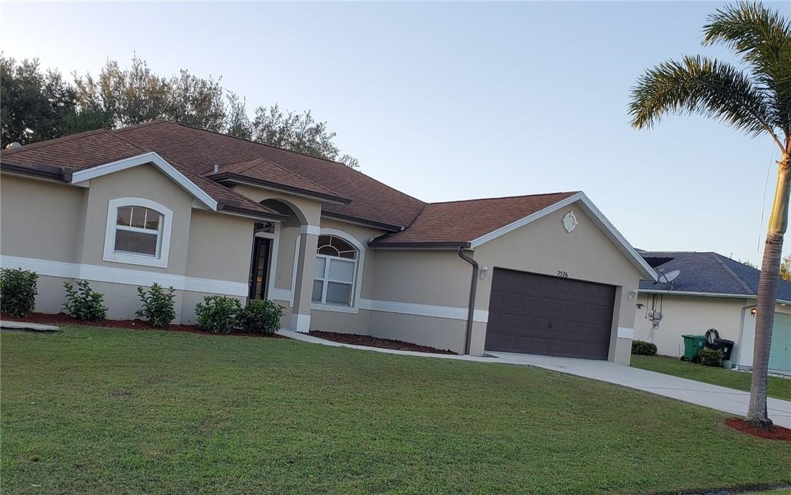 Ready for immediate move-in! Highly sought-after neighborhood with NO HOA! Well maintained 3/2/2 CBS construction with storm shutters, a roomy covered screened-in patio, and a large fully fenced backyard with plenty of room for a pool. The kitchen has beautiful durable Corian countertops, 42 in. cabinets, tiled flooring, french doors, and a large pantry. Carpeted living areas and tiled wet areas with a nicely appointed split floor plan. The primary bedroom features double walk-in closets, and sliding doors that lead to the relaxing patio- just the spot for a hot tub or to read a book. The all-tiled en suite features a separate shower and jetted tub, 2 separate vanities. The home is conveniently located to major shopping areas, restaurants, and highways. Vacant and Easy to show NOW!