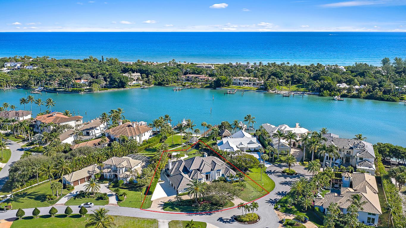 Stunning Intracoastal views! This home was extensively renovated in 2023 and features a chef's kitchen with Wolf & SubZero appliances, french oak flooring, stunning bathrooms, gas fireplaces, wet-bar with 300 bottle wine refrigeration, solid core doors, and designer finishes throughout. The outdoor living sets this property apart with a massive covered lanai, phantom screens, summer kitchen, resort style pergola, heated salt water pool, and meticulous landscaping. The home is concrete construction, has hurricane impact windows, 2022 roof, and 2025 generator for peace of mind. Rolling Hills is a gated community with a white sandy beach and day dock. This is a true coastal masterpiece!