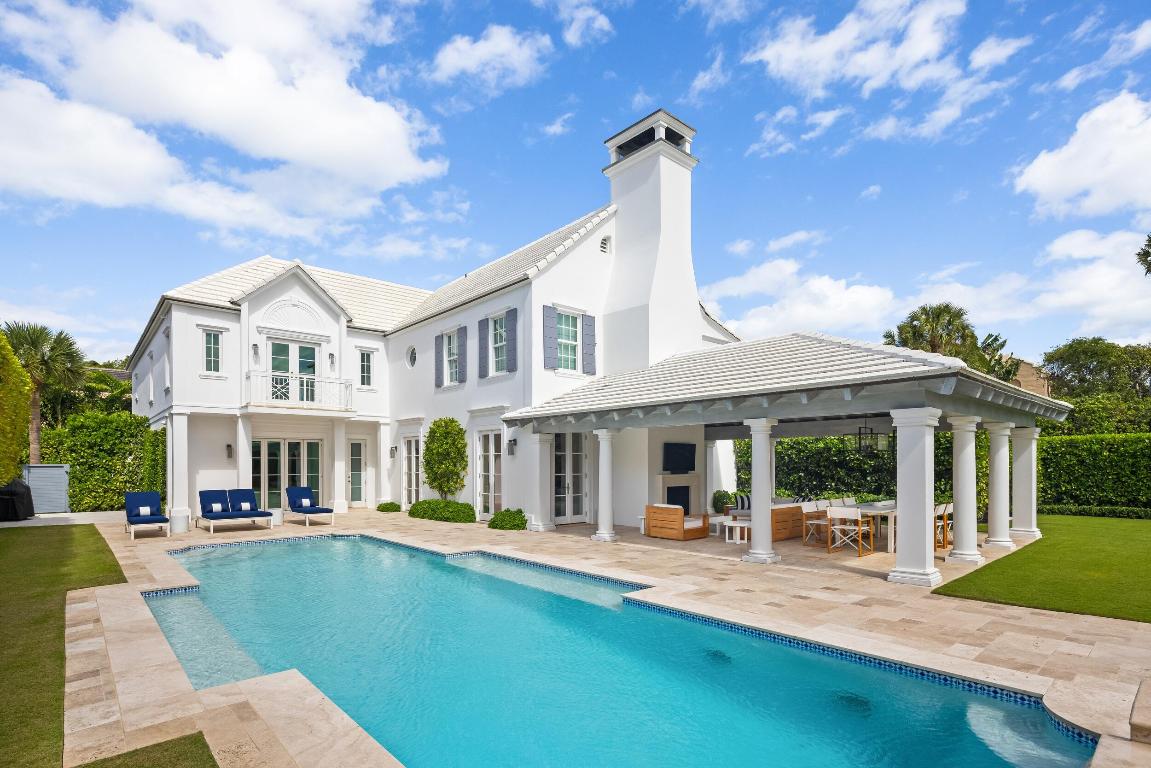 Stunning and pristine 5BR/5.2BA Georgian home beautifully renovated in 2022 with 7,500+/- square feet. Gorgeous and sophisticated marble and hardwood finishes throughout. Thoughtful interior design by Kenny Alpert. Immaculate landscaping surrounding fabulous backyard with resort-style pool, spa, and oversized loggia with fireplace. Living room features fireplace and stunning bar with wine fridges. Top-of-the-line eat-in kitchen with chef's island, wine fridge, and beautiful detailing. Sunny library with built-in shelving. Soaring ceilings, impact windows, and generator. Fantastic Estate Section location with beach access.