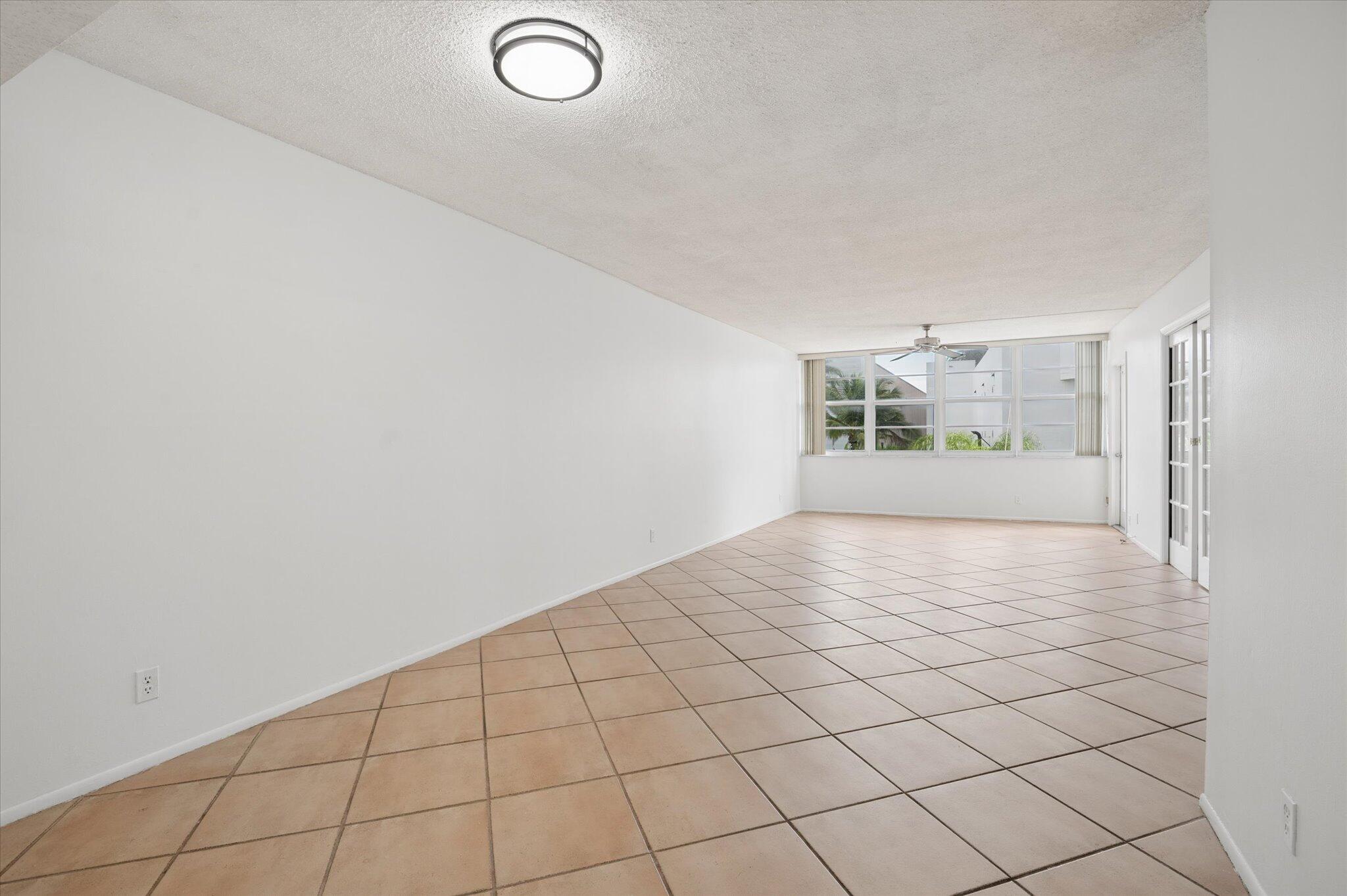 Spacious 2BR/2BA condo in East Point Towers featuring 1,344 sq. ft., north-facing balcony views of the Middle River, and an unbeatable Fort Lauderdale location near Federal Hwy and Sunrise Blvd. Renovated open kitchen with new appliances and custom cabinetry flows into the main living area. All tile flooring, impact windows and sliders throughout, oversized primary suite with extra-large walk-in closet, and spacious guest bedroom with windowed pocket doors. Includes 2 deeded parking spaces and 24-hour guarded security. Pet friendly (1 pet up to 30 lbs.). Resort-style amenities include updated pool overlooking the river, fitness center, sauna, community rooms, library, grills, sun deck, car wash station, and private dockage availability. Welcome to East Point Towers, two iconic 12-story towers nestled in a tropical setting along the Middle River in the heart of Fort Lauderdale.  This well-maintained 2-bedroom, 2-bath residence offers a rare combination of size, updates, and value. The north-facing orientation provides relaxing balcony views of the Middle River while allowing abundant natural light throughout the day.  Inside, the renovated open kitchen features custom cabinetry, new appliances, and a functional layout ideal for everyday living and entertaining. Tile flooring extends throughout the home, while impact-resistant windows and sliders provide peace of mind and energy efficiency.  The spacious primary suite includes an oversized walk-in closet and generous bath area. The guest bedroom offers flexibility for visitors or a home office, enhanced by attractive windowed pocket doors.  Residents enjoy an extensive amenity package including a recently updated pool and sun deck overlooking the river, fitness center with cardio and weight equipment, sauna, community rooms, library, card room, barbecue areas, car wash station, and private dockage availability.  The location is exceptional—minutes to the beach and within walking distance to George English Park, The Galleria, Gateway Theatre, Croissant Time, J. Mark's, Café Vico, and neighborhood tennis courts. Convenient access to Las Olas, downtown Fort Lauderdale, and major roadways makes this an ideal full-time residence, seasonal getaway, or investment opportunity.