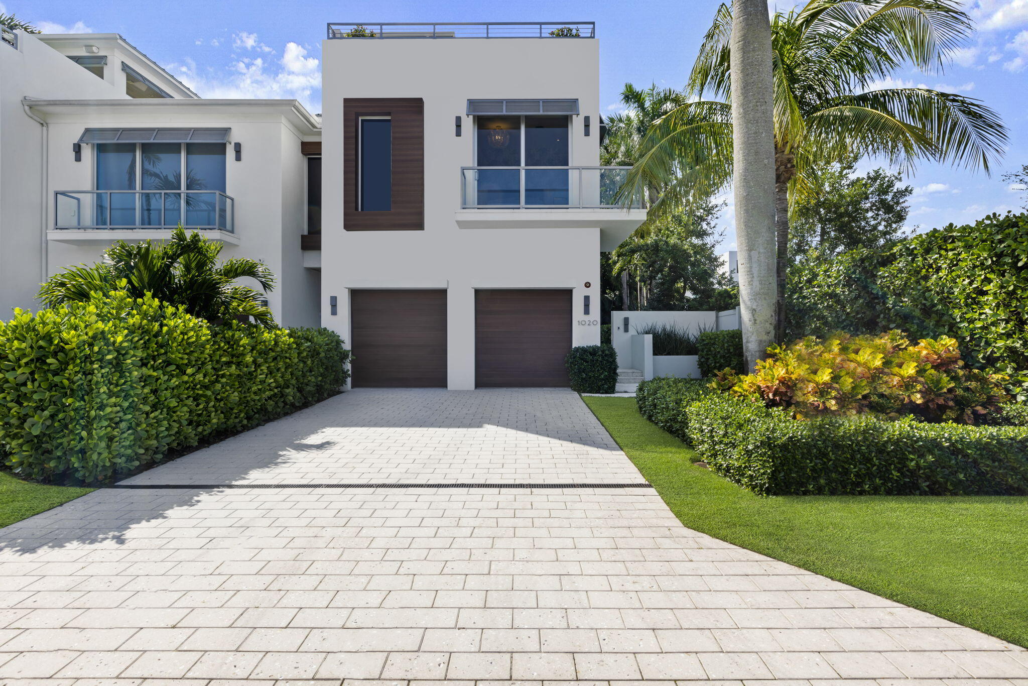 Introducing a masterpiece of coastal living, quality constructed 3 bedroom, 3.1-bathroom plus office luxury townhouse built by Azure in 2018 nestled in one of the most coveted locations, just two blocks away from the pristine beach and a stone's throw from the vibrant Atlantic Avenue. 
This exceptional residence designed and decorated by renowned Leighton Design Group offers a lifestyle of unparalleled sophistication and comfort.
Upon arrival, you'll be immediately captivated by the exterior, featuring a harmonious blend of modern architecture and coastal aesthetics.
As you step inside, you'll be greeted by a two level foyer that seamlessly flows into the open concept living spaces. The interior design is a testament to refined taste, with every detail carefully curated to... create an atmosphere of opulence and relaxation. 
The gourmet kitchen is a chef's dream, equipped with top-of-the-line wolf appliances including gas cooktop, built -in Subzero refrigerator and freezer, wine chiller, custom cabinetry, and a spacious island with quartz countertops. It's a perfect space for culinary creativity, and it seamlessly connects to the dining area, making it ideal for entertaining friends and family.
The living room is a sanctuary of comfort, boasting floor to ceilings windows that flood the space with natural light and provide breathtaking views of the lush surroundings and stunning blue salt water pool. 
The townhouse features an extra deep lot with multiple outdoor spaces, including a private rooftop terrace with panoramic views of the beach and intracoastal area. 
This serene oasis is perfect for sunset cocktails or morning yoga sessions. On the ground floor, a beautifully landscaped yard offers a secluded retreat for relaxation and the summer kitchen allows for the perfect setting to dine outdoors with a covered lanai and electronic screens. 
The spacious bedrooms are designed as tranquil sanctuaries, each with its own in-suite bathroom and ample closet space. The main suite is an epitome of luxury, featuring a spa-inspired bathroom with a wet room soaking tub and double rainfall showers.
Smart home technology has been seamlessly integrated throughout the property, allowing you to control lighting, climate, and security with ease.
This townhouse represents the pinnacle of coastal living, offering a lifestyle where you can effortlessly blend the beauty of the beach with the convenience of downtown living. Whether you're strolling along the shoreline, exploring the charming shops and restaurants nearby, or simply enjoying the serenity of your private retreat, this luxury townhouse offers the best of both worlds. It's not just a home; it's an embodiment of coastal elegance and modern sophistication.