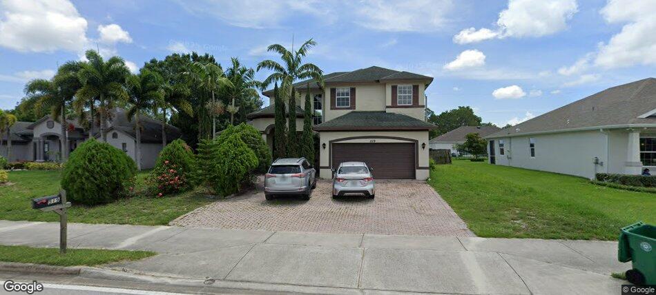 A priced-to-sell beauty, this large and spacious home welcomes you through a double-door entry with soaring 20-foot ceilings and a beautiful sweeping staircase. The interior features designer paint colors, dramatic picture molding, crown molding, art niches, plant shelves, and tile flooring throughout the main living areas. The kitchen offers 42-inch cabinets, granite countertops, and nice layout. The spacious primary bath includes dual sinks, a separate car wash-style shower, garden tub, and designer tile work. Large bedrooms and bonus enclosed patio area. Exterior highlights includes, Floratan grass, lush landscaping, and a brick paver driveway. Conveniently located minutes from the Turnpike and I-95. Call today to schedule your private tour.