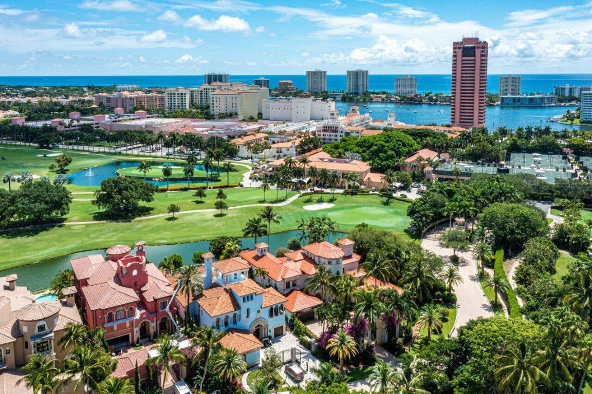Absolutely Extraordinary Estate on the grounds of the famed Boca Raton Resort and located on the most fabulous lot (over .59 Acres) in all of Mizner Lake Estates with incredible views of the golf course, lake and grounds of the resort. Features include a New Roof, impressive, gated entrance, beautiful living room with a decorative fireplace and high detailed ceilings, formal dining room with a wine room, huge chef's kitchen with custom cabinetry, new appliances and separate bar area. The first floor Master has a large sitting and 2 Master baths, there's a rich wood library with a full bath and 2 large bedrooms on the 2nd floor. The 3rd floor consists of an entertaining area, bar and balcony The loggia w/summer kitchen, pool/spa and a separate guest house.
