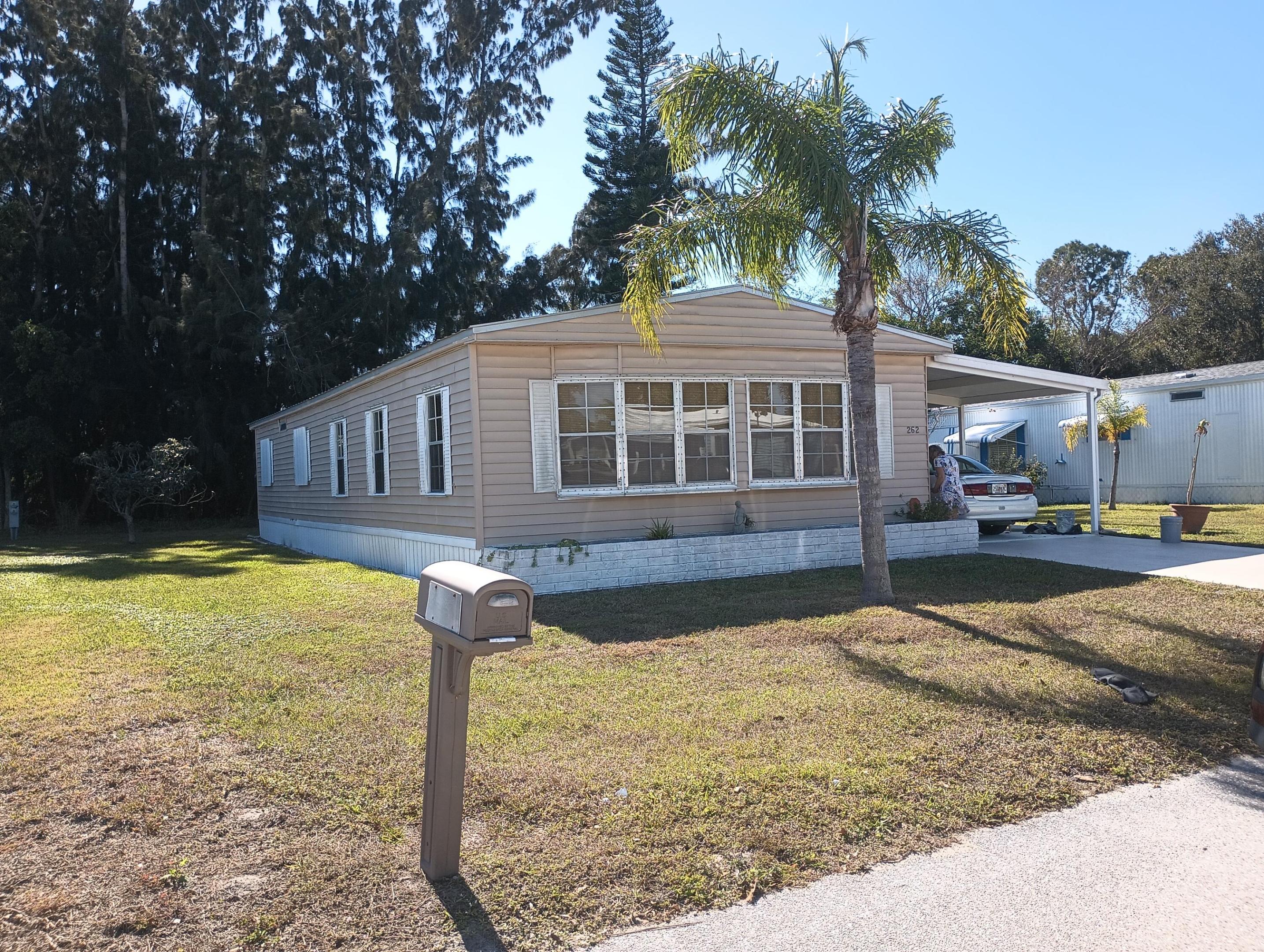Spanish Lakes Golf Village - 55+ Owner‑Occupied CommunityLand Lease: $930.98/month | 2 Bed • 2 Bath | 1980 Model  Move‑in ready 2-bedroom, 2-bath home in the desirable Spanish Lakes Golf Village, a 55+ community with resort-style amenities. Upgrades include a new metal roof (2021), hurricane shutters, tie-downs, vapor barrier, and a 2-year-old A/C system for peace of mind.  Bright, functional layout with spacious living and dining areas. Monthly land lease of $930.98 includes access to community amenities like golf, swimming, tennis, and clubhouse activities.  Park approval required. Ideal for seasonal or full-time Florida living in a friendly, well-maintained community.  Schedule your showing today and enjoy the Golf Village lifestyle.