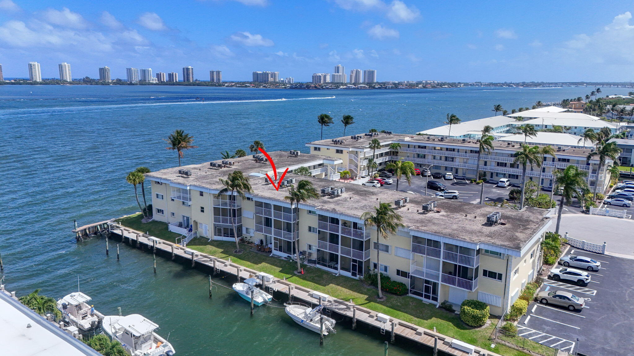 Experience serene waterfront living in this beautifully remodeled 2 bedroom, 1 bath condo perfectly situated on the Intracoastal Waterway in North Palm Beach. The updated kitchen features Martha Stewart cabinetry, brand new Bosch appliances, and a fresh, modern design that makes the space both functional and stylish. The bathroom has also been tastefully updated, complete with a spa like shower that brings a touch of luxury to everyday living. The true highlight of this home is the private balcony overlooking the Intracoastal—a rare and peaceful vantage point where you can watch boats glide by and, in the winter months, spot manatees swimming just below. Few communities offer the opportunity to rent a dock, allowing you to step out of your condo and be on the water within seconds. It's  an unmatched lifestyle for boaters and nature lovers alike. This quiet 55+ community is tucked away directly on the Intracoastal and offers a gorgeous waterfront pool, a welcoming community room, and assigned parking for convenience. Elevators provide easy access, and the laundry room on the same floor is exceptionally well maintained—bright, clean, and thoughtfully organized to make laundry day simple and stress free. Ideally located just minutes from shopping, dining, and all that North Palm Beach has to offer, this condo combines comfort, beauty, and an unbeatable waterfront setting. Enjoy the gentle waves, the coastal breeze, and the peaceful rhythm of life on your own private balcony. No rentals allowed in community the first year. Boat docks available.