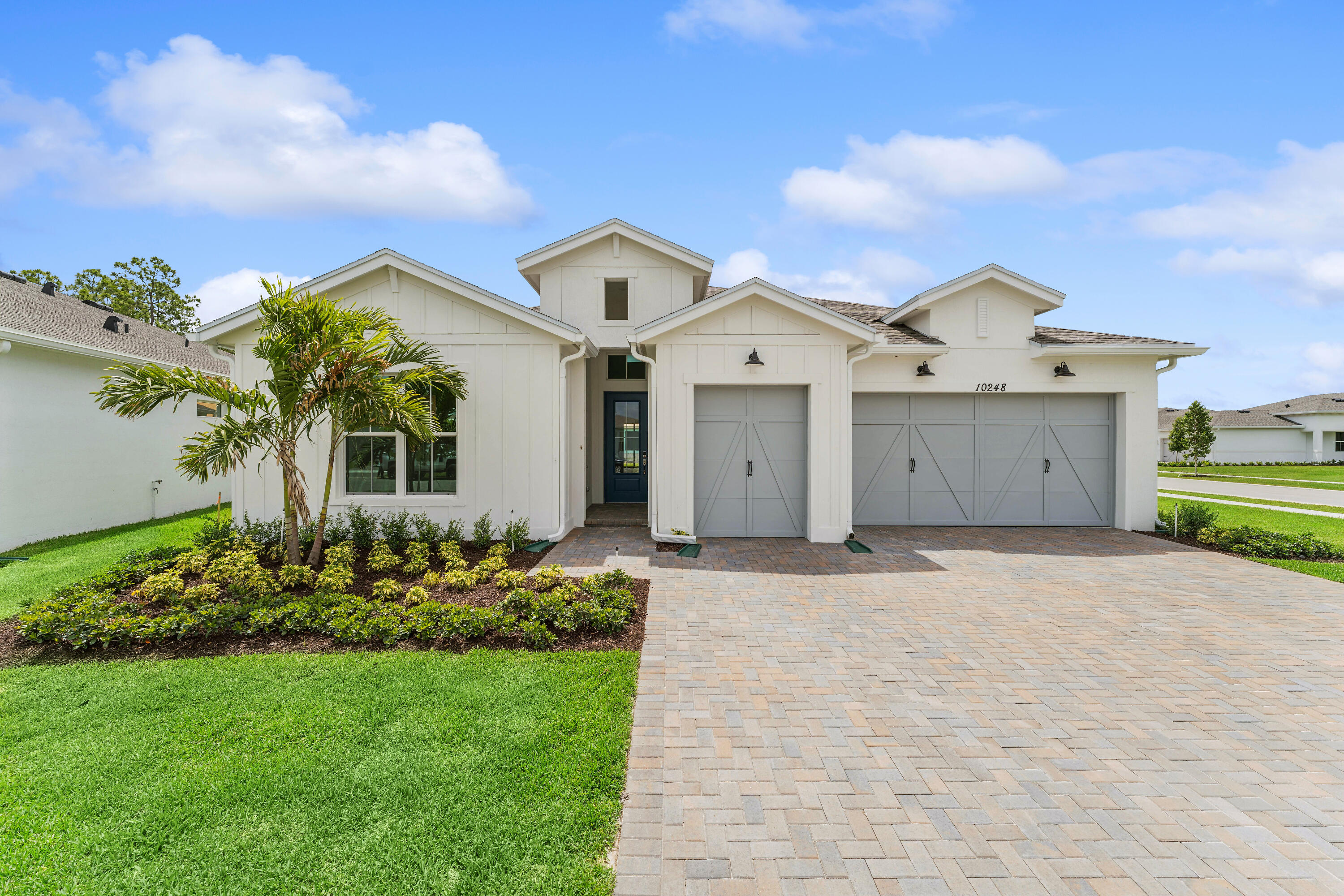 Located on an oversized corner lot, this Franklin model offers en-suite baths for all three bedrooms and a thoughtfully designed layout, ideal for comfortable living and entertaining. An elegant chef's kitchen features white cabinetry, Statuary Classique quartz countertops, abundant cabinet space, and a large island that opens seamlessly to the great room. The open and airy great room includes sliding doors leading to a covered patio, creating effortless indoor-outdoor living. A formal dining room just off the foyer provides the perfect setting for hosting guests. The luxurious primary suite is highlighted by triple windows, while the private primary bath offers spa-like comfort with an optional freestanding tub. A convenient two-car garage includes additional storage space to complete this home.