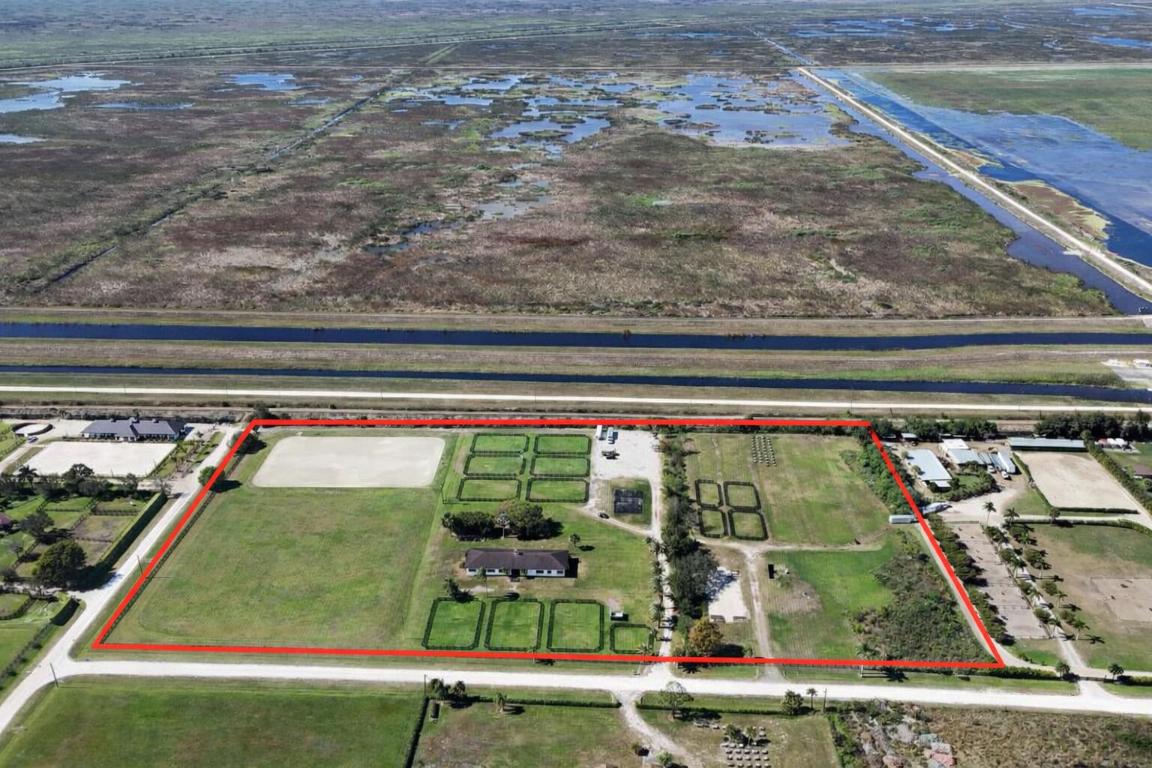 This remarkable property is overflowing with OPPORTUNITY!  RARE 15 acre parcel with 15 stall barn, Fit a regulation polo field in length, New top of the line GGT arena, Grand Prix Jumping field!  Current House pad ready to build your dream home!!  This strategic location is hacking to the show and on the expansion end of the showgrounds! Get your showing quickly before they pave flying cow roads.  Enjoy the newly remodeled nature preserve down the street. Equipped for riding trails, biking or even walk up the tower to enjoy the sunset and observe the land. Prime location as the neighborhood increases in value year after year!  The perfect facility really any discipline!