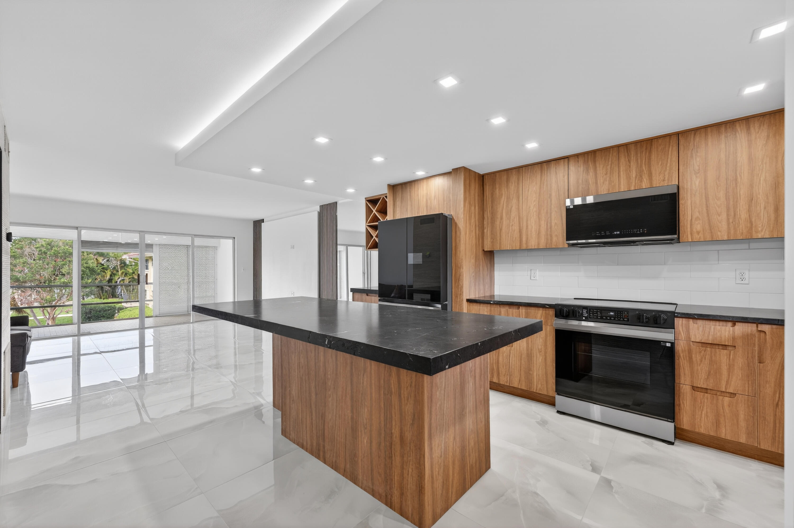 Completely renovated 2BR/2BA second-floor corner unit in Lighthouse Terrace, an 86-unit community in desirable Lighthouse Point. Approximately 1,000 SF featuring open-concept living, new kitchen with high-end appliances including smart refrigerator with built-in screen, updated bathrooms, new lighting, and porcelain flooring throughout. Bright interior with screened balcony overlooking gardens. Community offers pool, secure parking, and no age restrictions. Prime location across from dining and shopping, minutes to Deerfield and Pompano beaches. Cash only. No rentals. No LLC purchases. Sold As-Is. No assessments - paid in full by seller.