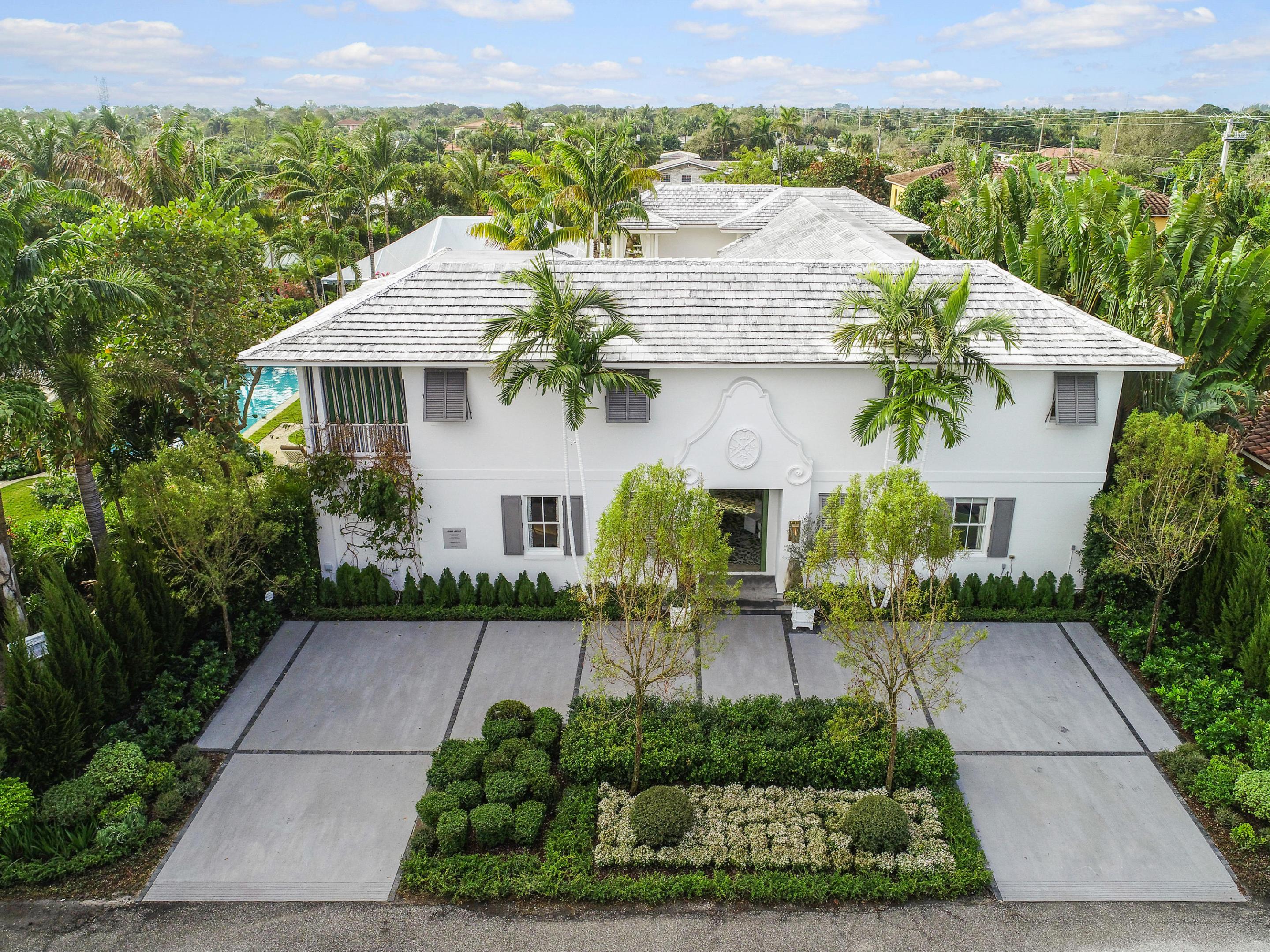 The house called Bamboo Hill and designed by Lars Bolander was chosen as the 2020 Palm Beach show house by the Kips Bay Boys and Girls Club and has roared onto the  housing scene after a complete redo.  The residence which is Dutch and South African inspired is again the most exciting property in the Palm Beaches.  Nothing comes close to its beauty and charm or resonates such south seas classic exoticism.  ( Think Somerset Maugham's stories).  It will be featured in the March issue of Veranda magazine where every room will appear.  It's tropical sensibility enchants its visitors beginning with the entry which has a two toned mural of leafy bamboo painted by noted artist Austin Kerr.  The double height living room brings to mind a Hollywood star in its total glamour and sophistication. The huge chef's kitchen has all new cabinetry and the latest Thermador appliances and Cosentino counters.  All baths also have new fixtures and cabinetry.  The excitement continues outdoors and when one steps down from the 50 foot loggia into the creation of a Mughal style Persian garden with two guest houses and a lounging pavilion for the large pool. This beautiful tropical setting offers 2 casitas, which can be used as bedrooms, gym and studio/massage room with sink and outdoor showers. Lavish is the word and excitement is the result.  This property is a true must see.