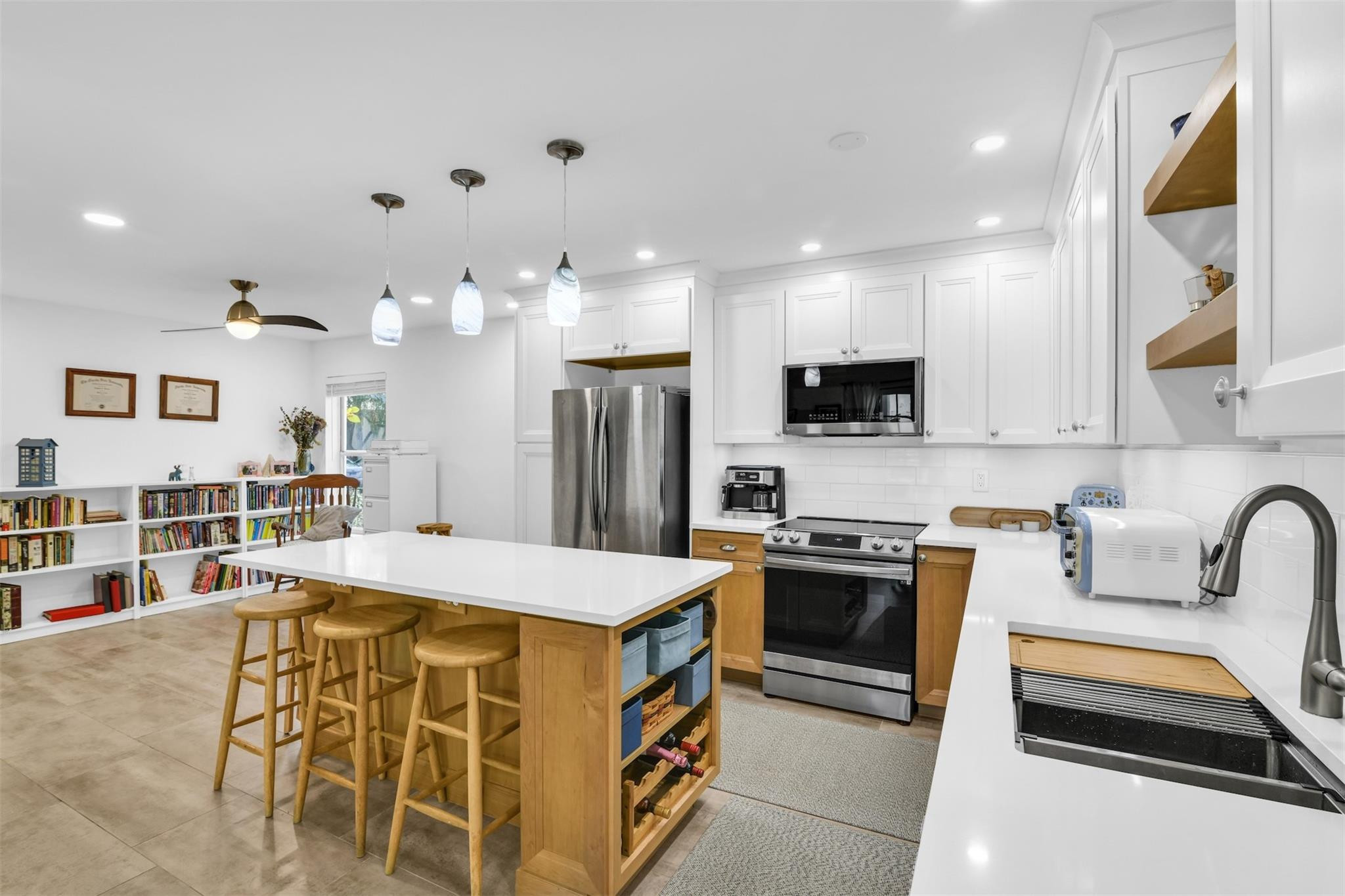 Low $138/month HOA. Beautiful Scandinavian- inspired renovations in this Single Family Home . Two-story house in a quiet cul-d-sac . Extended family room next to the kitchen. 80k in renovations , steps from the community pool, all fenced, high ceilings at the entrance. 3 bedrooms 2.5 bathrooms . Snow-white quartz countertops, stainless-steel appliances and sink. Wood-tile accent walls in the bathrooms, rain-fall shower. Large closets with organizational shelving, drawers and pull-out racks. Laundry has stacked front-load washer/dryer, soak-sink and folding counter. Tile floor  throughout. Short distance to stores, supermarket, parks, schools and public library. Quick access to main roads, 20 minutes from the airport. Come and enjoy this beautiful home.