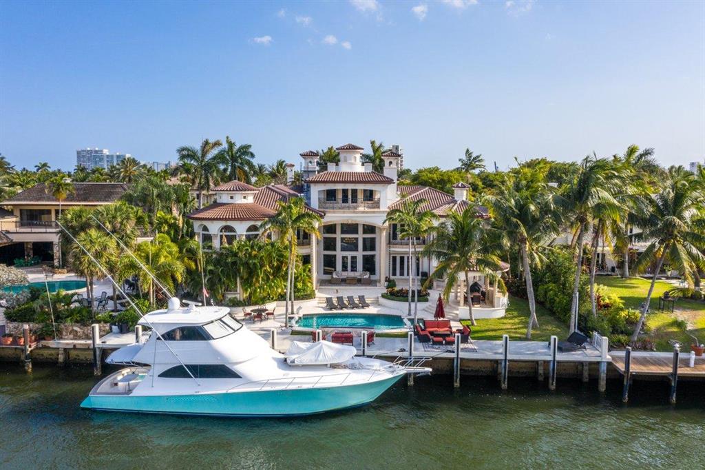 Sprawling Intracoastal estate home located on a private gated island in the heart of Fort Lauderdale. This recently renovated contemporary/mediterranean home features  stunning upgrades, an open floor plan with soaring ceilings & luxurious amenities. Features include a top floor theatre room, full smart home with both Lutron and Crestron systems, gourmet gas kitchen with Thermador and Mielle appliances, gym with sauna, 2 master suites on the 1st & 2nd floors, Summer kitchen, 110 ft dock, and ultra glamorous fixtures throughout. The garage can accommodate eight cars with lifts. The perfect location for boating, less than 10 minutes to the ocean, downtown, beaches and more.