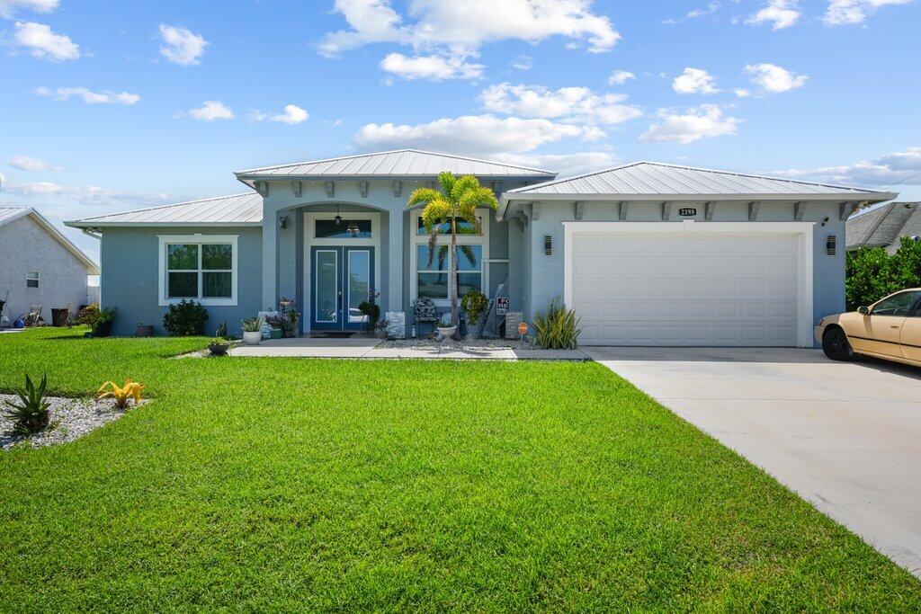 Experience luxury waterfront living in this impeccably maintained, 3-year-old home featuring 4 bedrooms, 3 bathrooms, a private den, and a separate guest/in-law suite with its own entrance. Premium finishes include a 2023 metal roof, impact windows, solid wood doors, custom closets, Italian tile flooring, and elegant tray ceilings. The open-concept design showcases a gourmet kitchen overlooking the spacious living area with an electric fireplace and stunning lake views. Situated on a quarter-acre lot, enjoy direct access for boating and water skiing from your backyard, all while being just minutes from shopping, dining, and everyday conveniences.