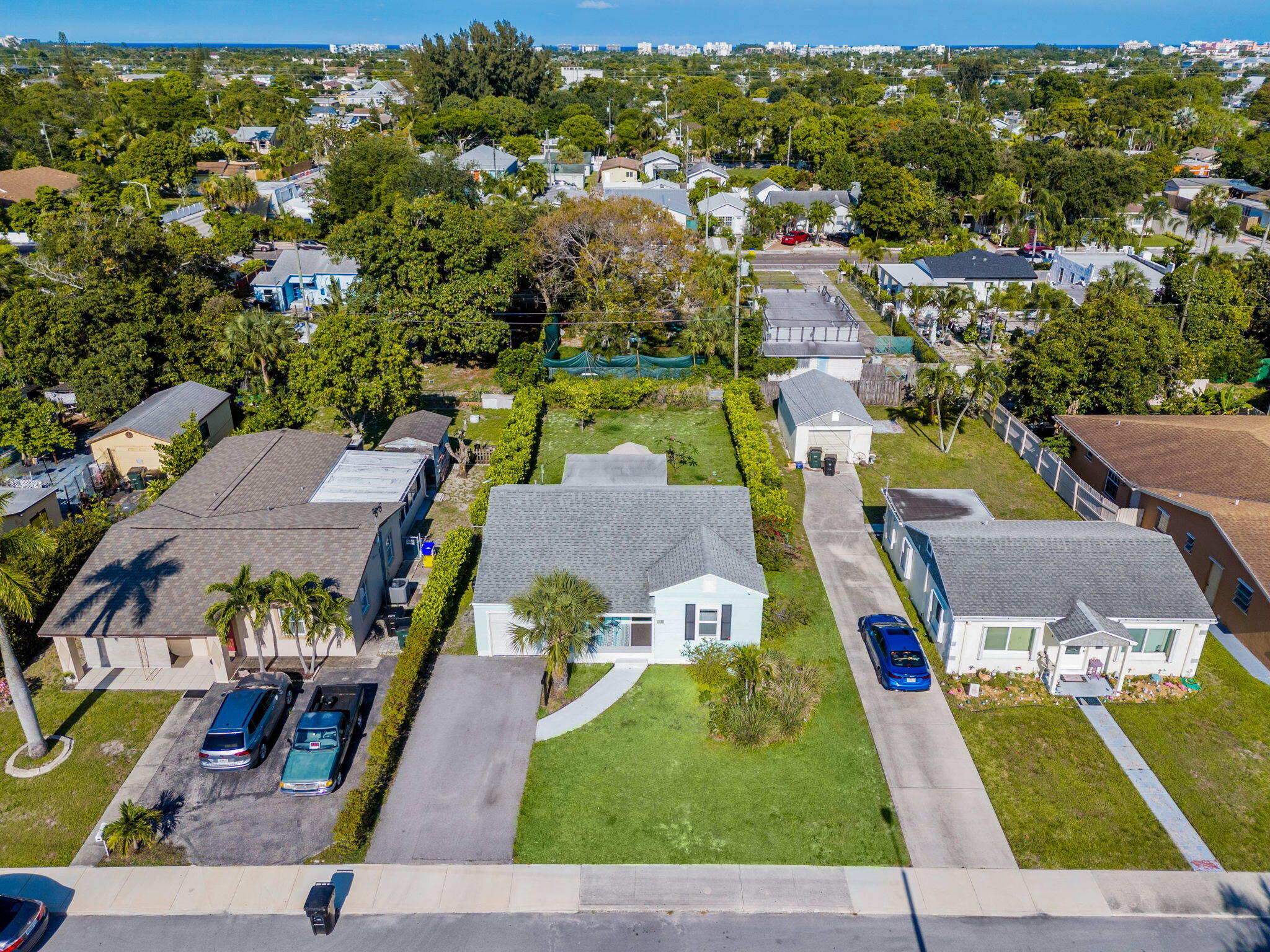 Just minutes from the beach and downtown Lake Worth Beach, this beautifully remodeled cottage has the kind of charm and warmth everyone loves. Inside, you'll find gorgeous high end luxury vinyl plank flooring, a bright updated kitchen with granite countertops, custom cabinetry, and upgraded plumbing and electrical. Outside feels like your own tropical retreat with a new entertaining deck, lush fenced yard, fruit trees, irrigation system, and privacy hedges. Take full advantage of all the heavy lifting already being done for you that includes hurricane impact windows, newer roof, updated light fixtures, designer inspired paint, exterior paint, and so much more!  Excellent airbnb and investment potential. Schedule your private showing today!