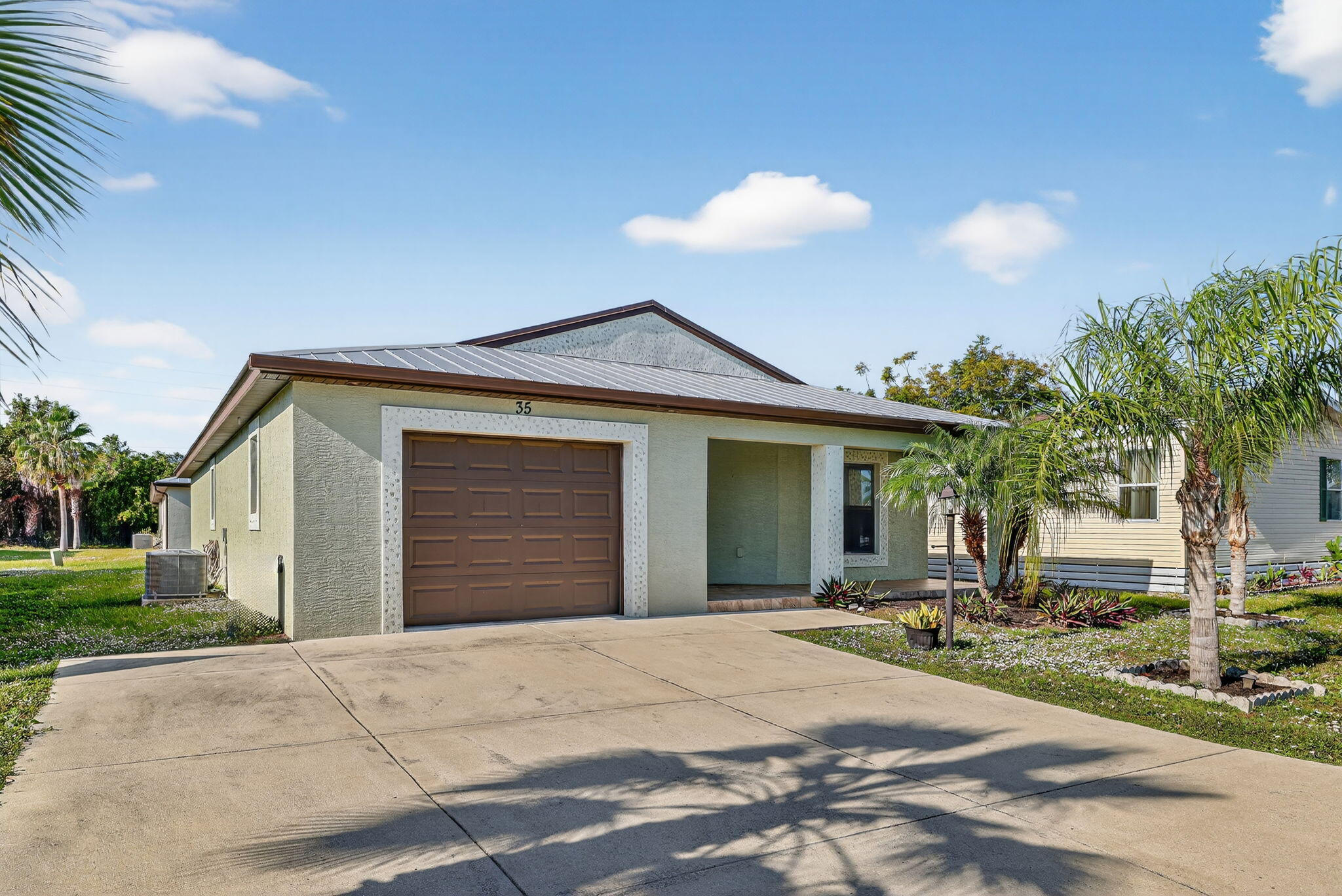 Want ELEGANCE, DURABILITY, SAFETY & AFFORDABILITY? This 2019 2bed/2bath home in a 55+comm. is BUILT to LAST. Concrete Block Construction is designed to withstand storms & Metal Roof, built over 5/8'' Plywood offers maximum strength. KeyPad Entry, OpenConcept, Vaulted Ceilings,LED Recessed Lights, Large rooms, GRANITECountertops, Stainless Steel Appl, MoenFaucets. Master suite w/ walk-in closet, en-suite bathroom w/ dual sinks & handheld shower head. Separate laundry room. LARGE PATIO & front porch w/ WATER VIEWS. PRIME LOCATION; beach, shopping,mall,grocery, bank,hospital,postal & more! Lot leaseONLY 637.77 includes trash, lawn care, Clubhouse w/Activities, Private FREEGolf Course,Heated Pool,Spa,Fitness,Pickleball,Tennis, Shuffleboard,Bocce,Library, Bingo,Parades, MahJong,Workshop &more!