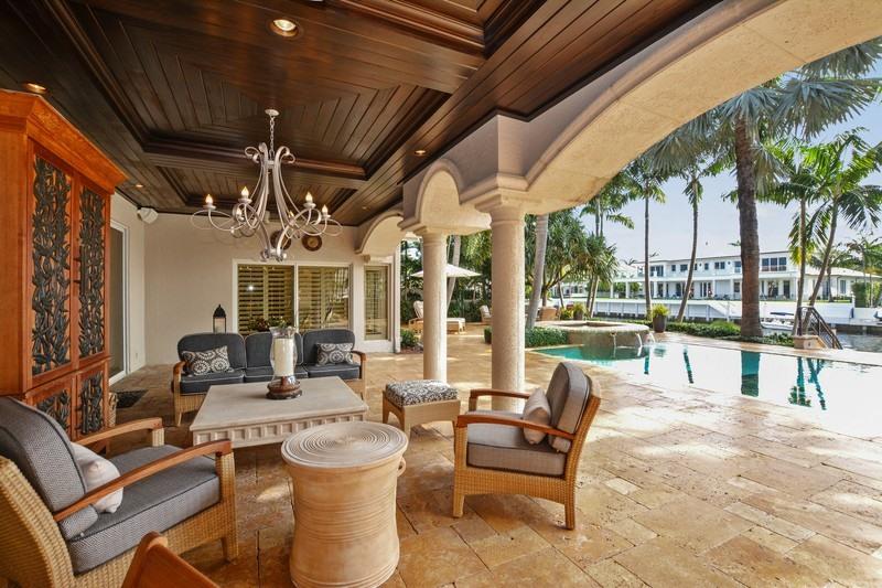 Updated in 2014, this stunning home sits on one of the best lots in Royal Palm Yacht & Country Club. Located on the corner of the grand canal, with southern exposure overlooking the newly renovated yacht club. The large patio features a gazebo with a summer kitchen and bar. The pool has a floral mosaic tile. Cement dock has both power and water. Whole house 70 kilowatt generator with a 500 gallon underground propane tank. https://youtu.be/TEOeEpB31LY