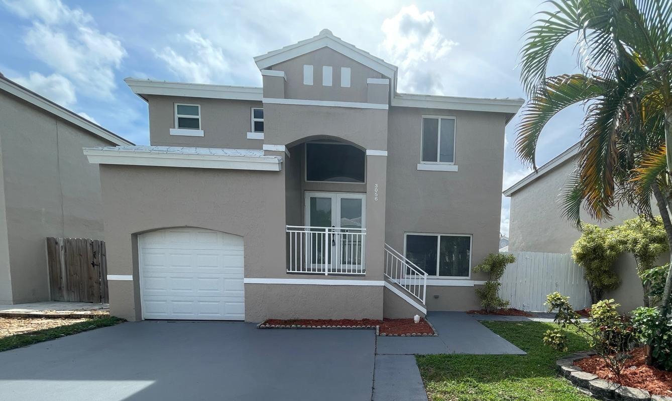Gorgeous 2 story home with 3 bedrooms 2.5 baths and 1 car garage. This home has been transformed with a beautiful New kitchen, New baths, New flooring and painted for comfort. 2021 Roof, 2021 Impact windows and doors, large fenced back yard. Extremely low HOA offering gated community, pool, play ground, basketball and tennis courts. Picky buyers welcome. Location and Beauty. Near shopping, Tradewinds Park, Seminole Casino and Fine Dining..