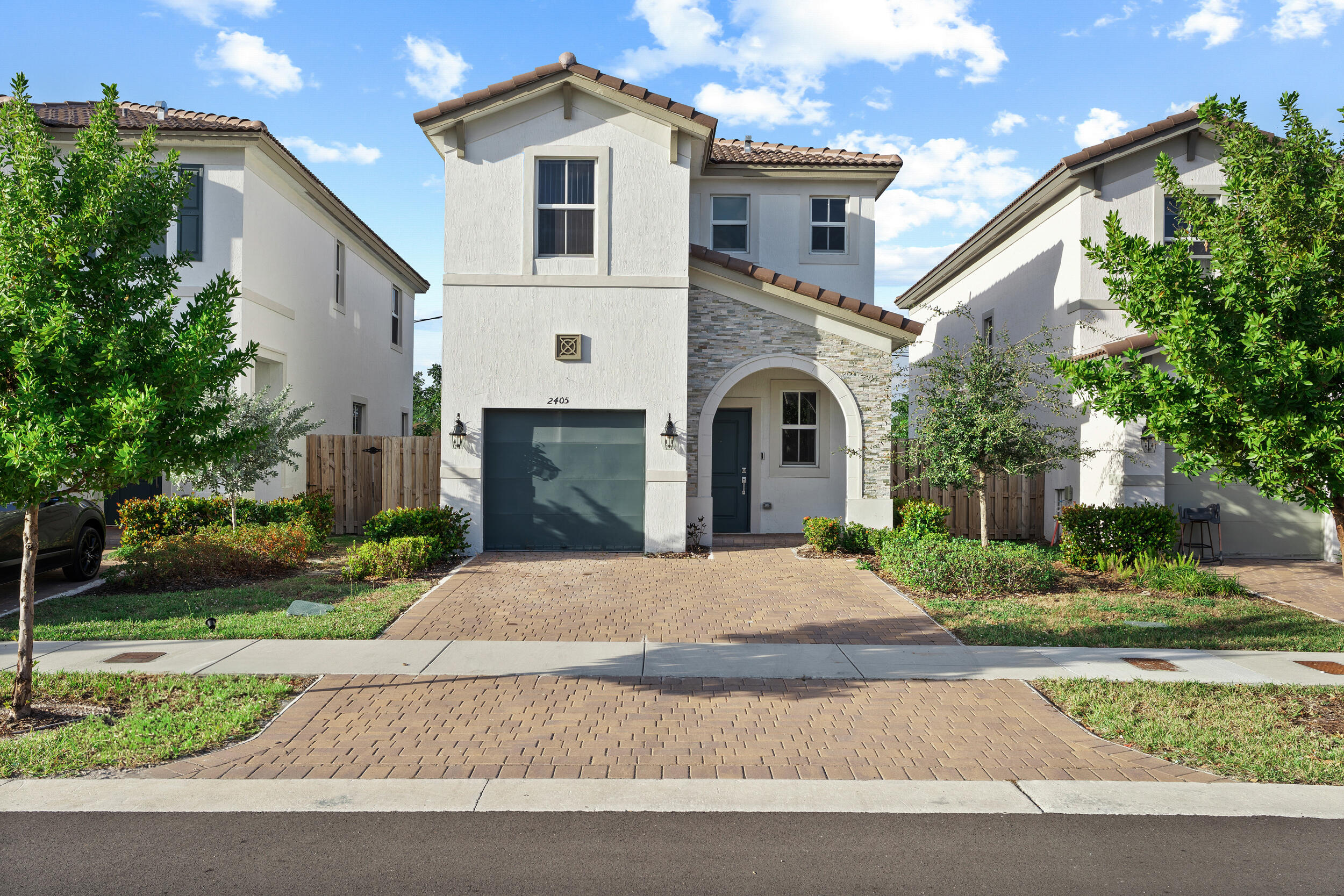 Beautiful 3-bedroom, 2.5-bath single-family home located in the desirable Westview community by Lennar, in the heart of Miami. This spacious "Amelia" model features tile flooring throughout the first floor and carpet upstairs, offering both style and comfort.  Enjoy a modern kitchen with stainless steel appliances, quartz countertops, and plenty of cabinet space. The home also features a private fenced backyard, perfect for relaxing or entertaining outdoors. Includes 3 parking spaces with garage. Equipped with SMART HOME technology designed to enhance convenience and help reduce energy costs. Ideally situated on a premium lot facing expansive green areas and community amenities.