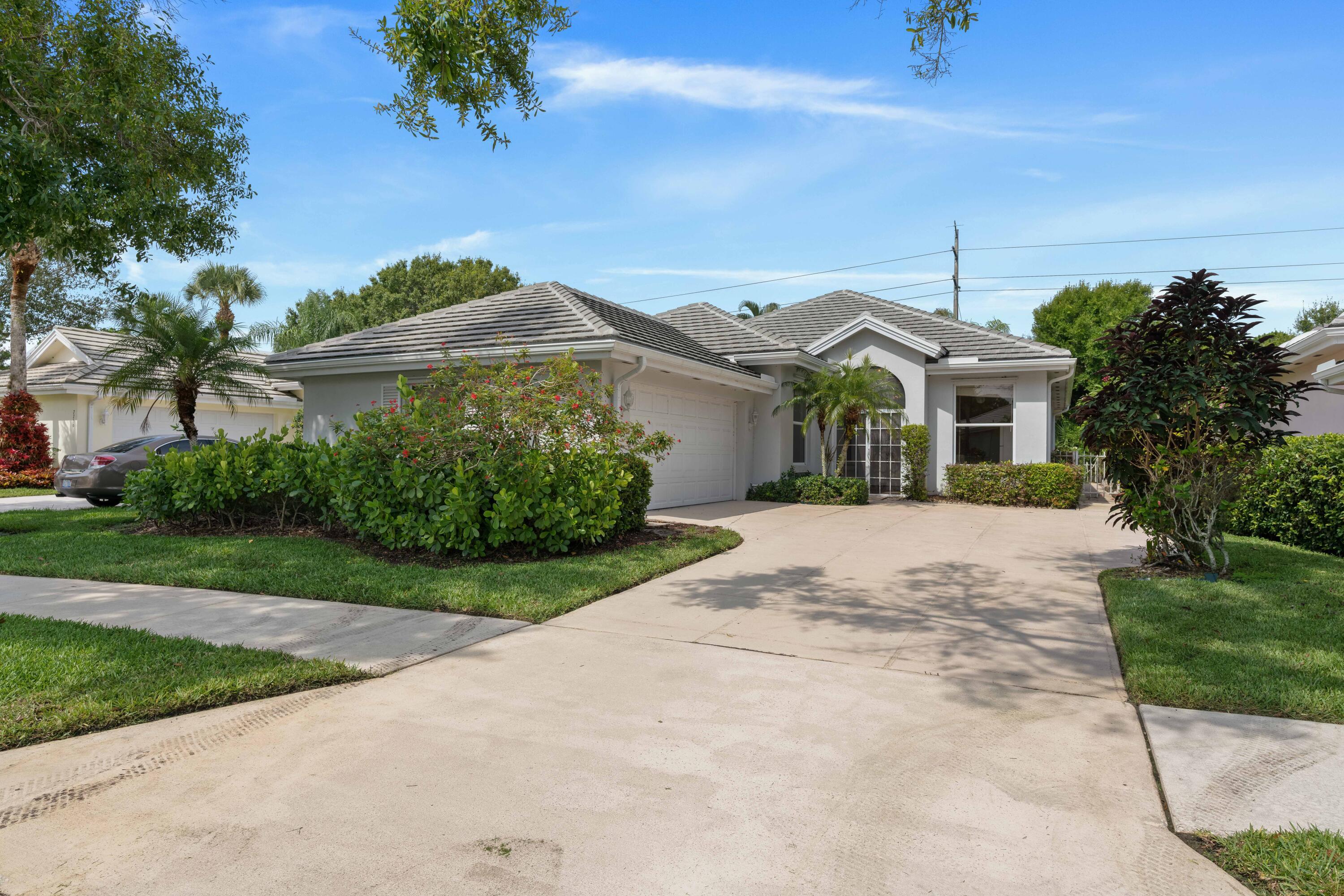 Incredible opportunity to own a home in the highly sought-after Preserve Plats of Hobe Sound. This charming 3 BR/2 Bath 1-level single family home features a lake view with endless views to the preserve, vaulted ceilings throughout, updated kitchen countertops, New A/C, newer roof done in 2020, and a secure, friendly gated community. This well maintained home features a large 2 car garage and is tucked in near a cold a sac backing up to the preserve. Utmost of privacy and mature landscaping  with a tranquil backyard and serene sounds of nature. Great home for entertaining and a highly desirable split floorpan, Divosta built CBS home. Close proximity to Florida's premier beaches, golf courses, including Grove 23, boating waterways, parks, shopping, hiking and pristine dining. Close distance to 95 & the turnpike. Hobe Sound is a beautiful, quaint town that gives you that true Florida living feel. Many new restaurants and commercial opportunities in Hobe Sound, surrounded by some of the most pristine Real Estate in the world on Jupiter Island in Hobe Sound, this is a must see and fantastic opportunity!