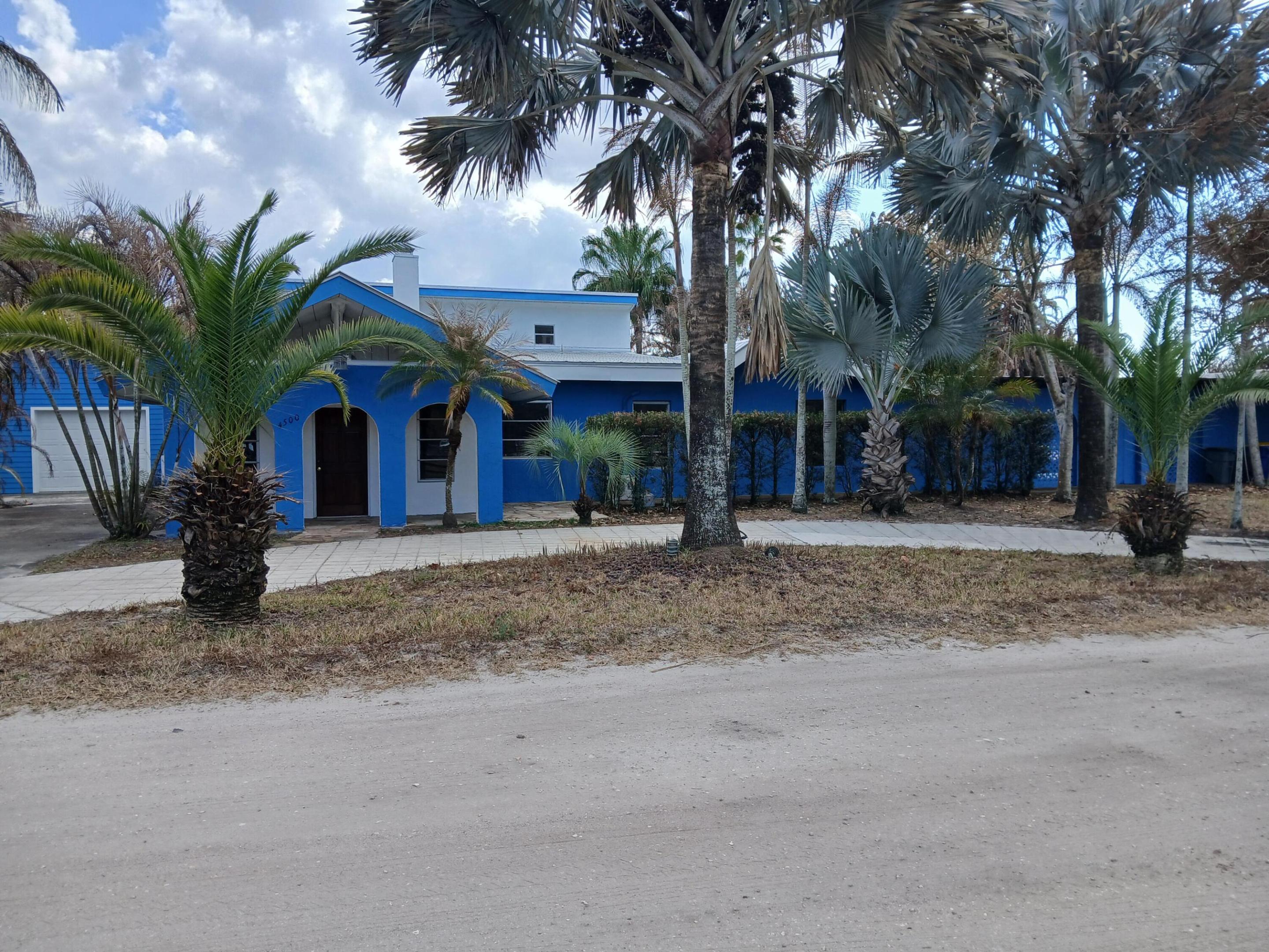 UPDATE: House is under renovation, details upon request. One-of-a-kind 5-acre jewel in desirable Palm City Farms, NO HOA! 3,602-sf CBS with METAL roof over all. Detached 900-sf 4+ car garage. Enjoy family time in your 40x20 enormous swimming pool with giant patio! Main house 2,802-sf, 4br/3ba, tall 14ft wood ceilings, breathtaking stone fireplace, spacious master bedroom with updated master bath, spacious kitchen with high-end brand-new stainless-steel kitchen appliances, and lots of storage. New salt-water pool pump, updated well-water system, new water heater, and fresh interior-exterior & pool patio paint. 800-sf Guest house has 1br/1ba. 4-acre cross-fenced back pasture with 2-gated entrances, corner lot. Over 200 palm trees. Add a horse barn, bring all your toys. Fu rniture negotiable. Enjoy a private location while still close to shopping, dining, I-95, A-rated schools!