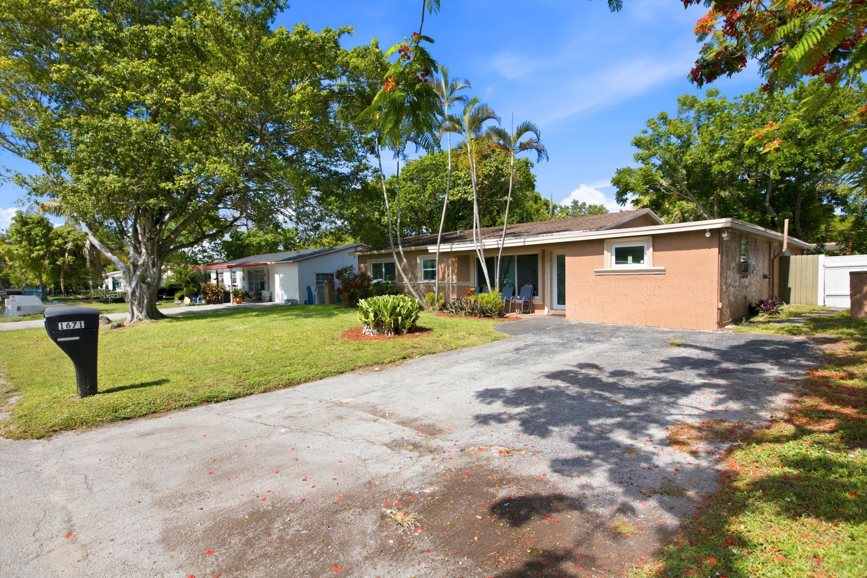 Welcome to your dream home on a quiet, dead-end street in one of the most desirable neighborhoods with NO HOA! This beautifully updated 4-bedroom, 3-bath home boasts a modern kitchen, impact windows and doors, and a spacious backyard with a playground swing set. Just minutes from the beach, major highways, and local parks, this gem is truly a rare find. Don't miss out—schedule your private tour today!