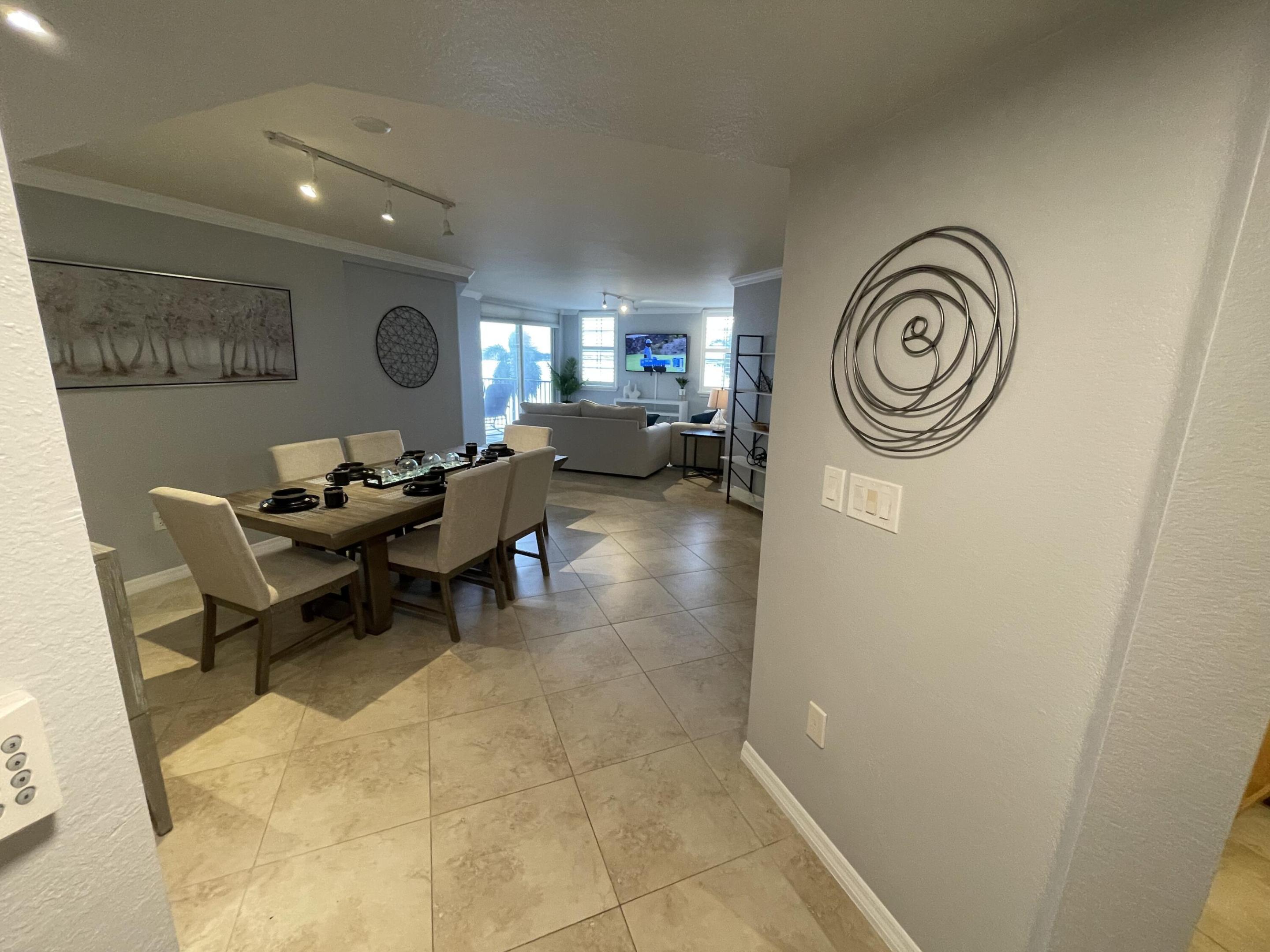 This condo features a unique custom floor plan. The entire unit has been freshly painted and remodeled. Originally a 3-bedroom, 2-bath condo, it has been converted into a spacious 2-bedroom, 2-bath unit, making it perfect for your annual or seasonal rental for 2026/2027. Enjoy beautiful intercoastal views from your oversized corner balcony, which provides panoramic views of West Palm Beach, Palm Beach, and all the way to Singer Island. The custom two-bedroom, two-bath condo boasts 1,588 square feet of air-conditioned living space. One of the oversized master suites has new carpet, and the kitchen features granite countertops and stainless steel appliances, including a new front-loading washer and dryer. This condo is truly one-of-a-kind—there's nothing else like it at Flagler Pointe!