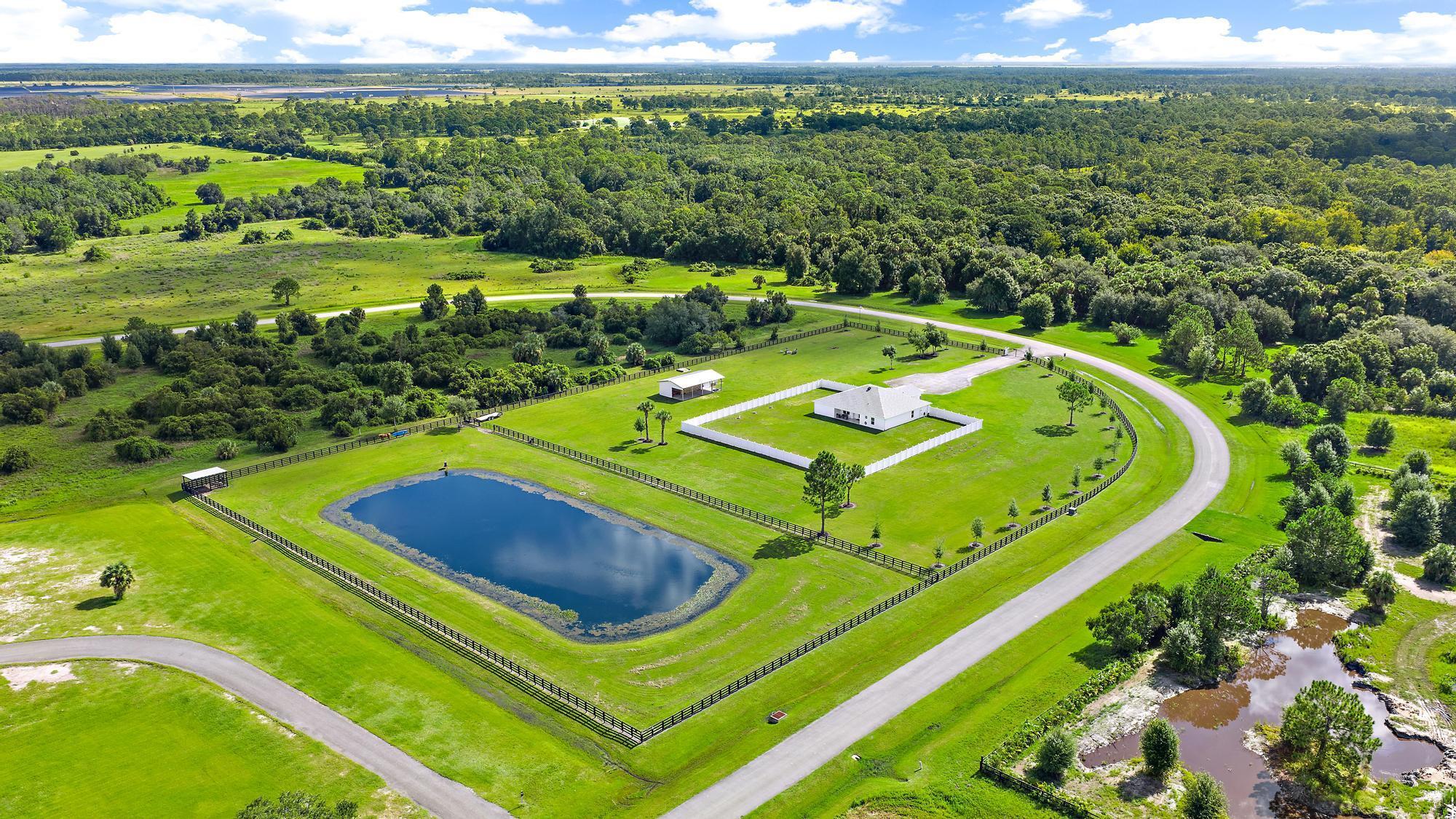 Discover Horne Ranch - a turnkey 2022 CBS country estate blending modern comfort with equestrian-ready living. This spacious 4BR/3BA, 2,500+ sq ft home sits on 5.41 acres of fenced, horse-ready land featuring a 960 sq ft barn with tack room, lush pastures, and a lean-to by the pond with water access. Enjoy vaulted ceilings, a well-appointed kitchen, and a flexible layout ideal for everyday living or entertaining. 4-board perimeter fencing secures the acreage, while a 6-ft PVC privacy fence encloses the yard for added seclusion. A rare opportunity for refined country living - schedule your showing today.