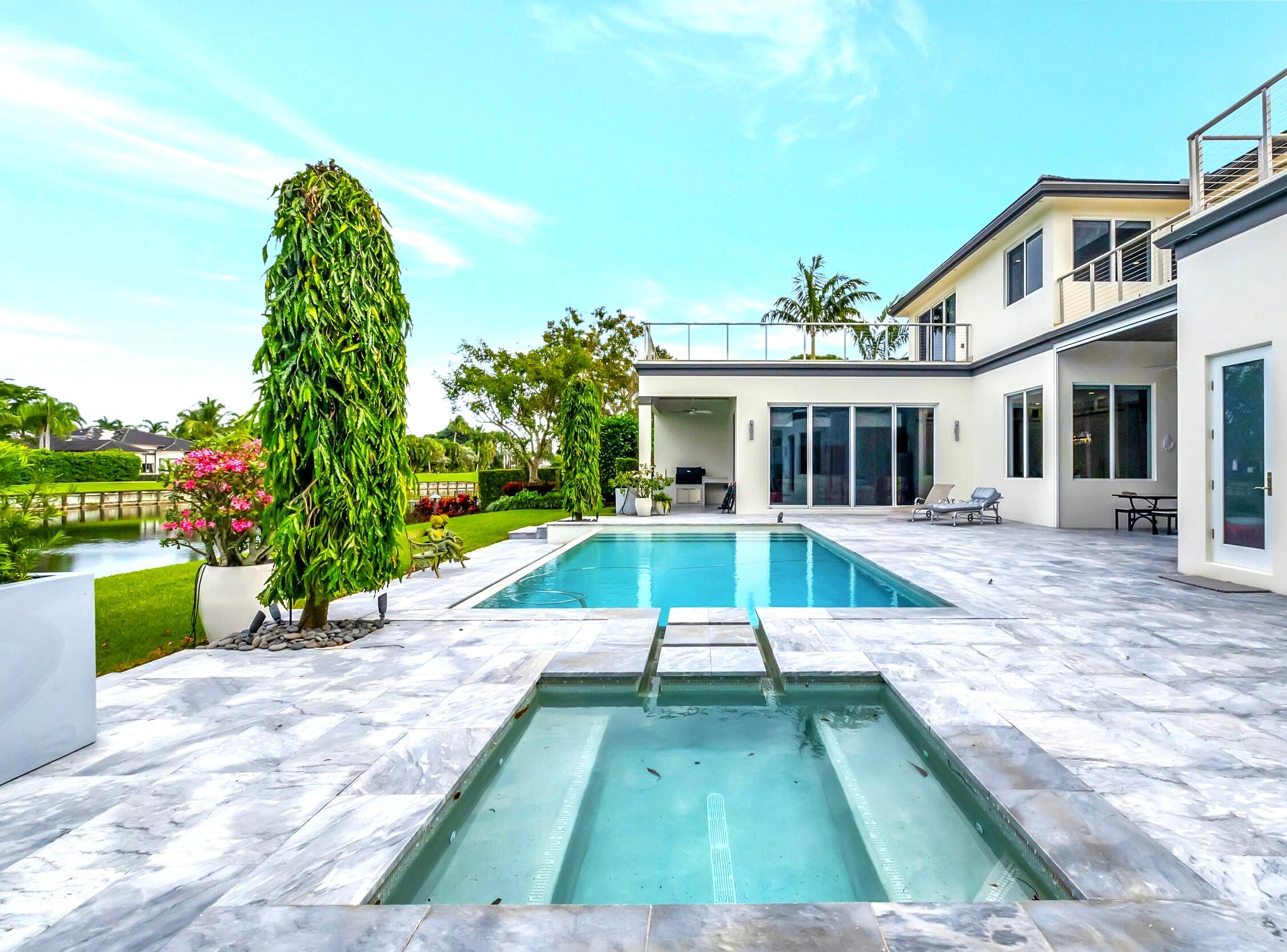 A fabulous opportunity to enjoy the vibrantly social St. Andrews Country Club. Custom crafted for ultra luxe living, this contemporary home was built in 2017. 6 bedroom & 7.3 bath estate overlooks magnificent lake & golf views. The home has been gently lived-in. Includes formal living & dining room, gourmet kitchen, large breakfast area, family room, home theater, game room & office. Exquisite owners suite offers generous closets & his & her baths. There is a resort style pool & spa, outdoor kitchen, generator & 4-bay garage. The home features impact windows & doors, quartz counters, center kitchen island, high end stainless steel appliances, hardwood floors throughout, elevator & a 700-bottle wine cooler. Lush landscaping completes this extremely private & exclusive retreat. Unique upgrades include: smart lighting with Lutron dimmers, a smart heating & cooling pool using iAquaLink, fully smart Google home, motorized black out shades in the bedrooms, motorized sun-shades in living room and office, & Reme Halo UV light in-duct Air Purifier. This home is truly plug-&-play, turn-key, & fully manageable from your smartphone.
St. Andrews is recognized as an Elite Distinguished Club of the World, a Platinum Club of America and on the Top Ten Healthiest Clubs of America. In 2019 St. Andrews was awarded the North America Best Day Spa Award. The manned guard community has a roving armed guard patrol along with 24 hour state of the art video surveillance. 
Located within close proximity to Palm Beach International along with Fort Lauderdale airport and Boca Executive Airport, St. Andrews is conveniently positioned for a winter retreat only a quick drive to the coast or to both Mizner Park and Delray's Atlantic Avenue.