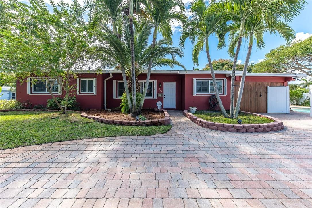 This lovely 3br/2ba pool home is a nature lover's nook! Situated on a corner lot, this home boasts an oversized, fenced yard with freeform pool and surrounding butterfly garden! Outstanding features include split bedroom plan; large master bedroom with custom cedar closer; updated kitchen with new stainless steel appliances, granite counters & wood cabinets; plantation shutters; impact windows and/or accordion hurricane shutters throughout; paver circular driveway; natural, native butterfly garden; freshly painted exterior and new roof! When not enjoying the home - bike to the beach or many nearby restaurants and shops! Hurry! This will not last!