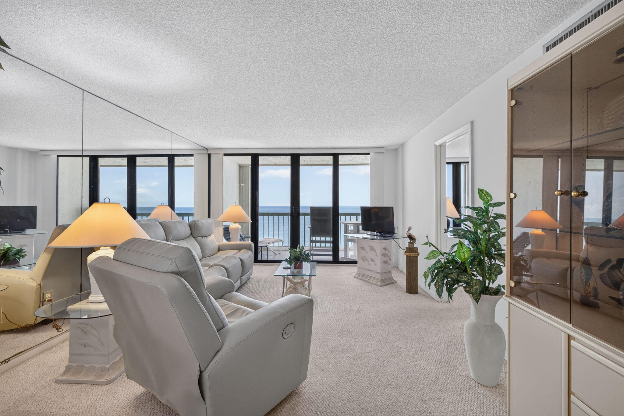 Wake up to spectacular sunrises from this 15th-floor oceanfront condo. This property features new storm-rated sliding glass doors, a new front door, and new flooring extending from the entryway through the kitchen and dining area. The condo also includes a new couch and recliner, adding comfort and convenience.  With its unbeatable location, stunning panoramic views, and endless potential, this is a rare opportunity to own your own piece of paradise. Whether you're looking for a full-time residence, vacation getaway, or investment property, this high-rise gem is ready for your personal touch. Bring your vision and transform it into the oceanfront home you've always dreamed of!