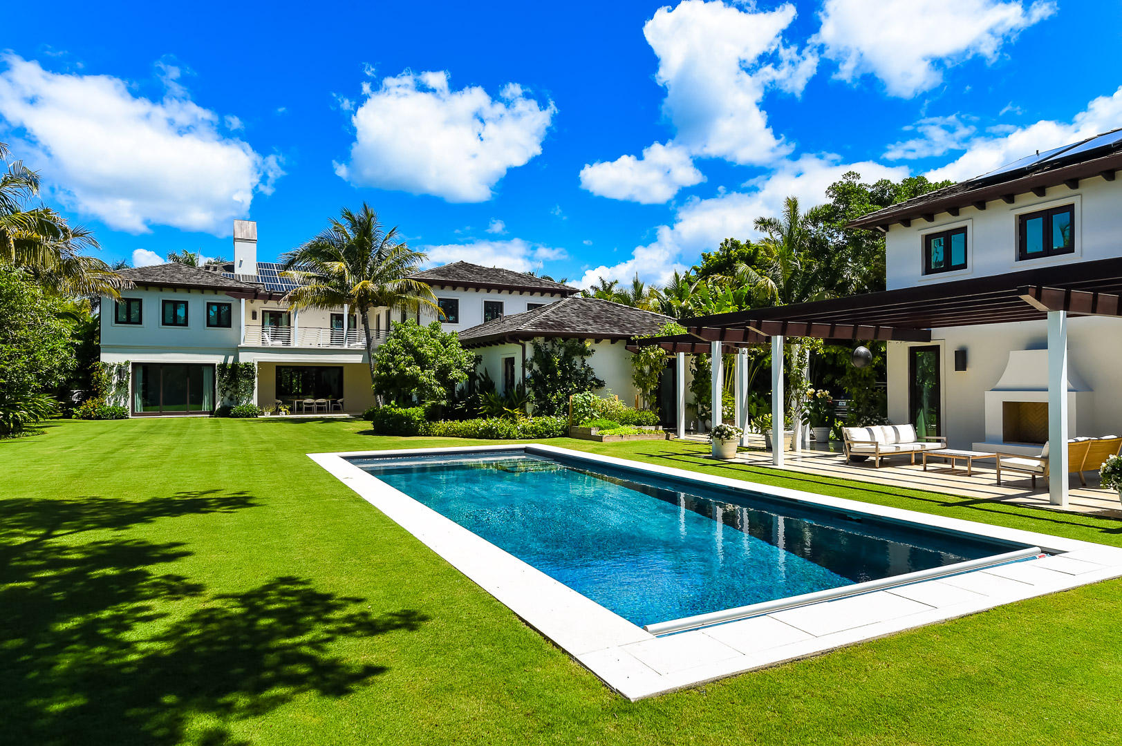 Built to the highest standards, this north-end home is situated on a rare oversized lot measuring 0.64 +/- acres. The property offers a main residence featuring 7 bedrooms, 8 full baths and 2 half baths, a 1 brd/2 bath guest house, and a 3-car garage, offering total combined square footage of 11,000 +/- sq. ft. 
With custom details throughout, spacious light-filled rooms, new chef's island kitchen, south-facing master bedroom with private terrace overlooking the pool area and beautiful tropical gardens designed by Nievera Williams Design the main residence offers gracious and serene living. 
The expansive grounds include a large swimming pool, out-door fireplace, herb-garden, and open loggia all of which provide the perfect setting for entertaining, and privacy.  Beach & Lake Trail Acces