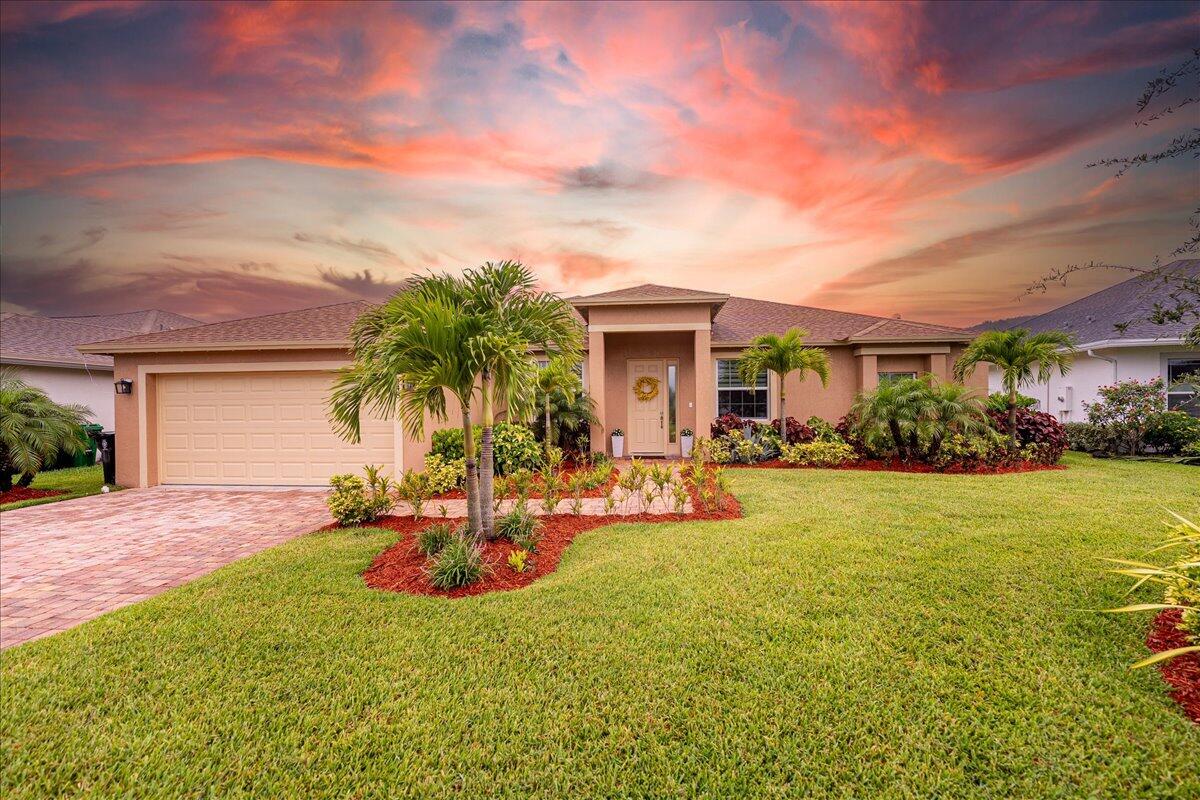 Welcome to the Estates at Sawgrass Lakes, one of Port St. Lucie's most desirable lakefront communities—where wide water views, superior craftsmanship, and low HOA fees combine to create a rare blend of elegance and value.
This immaculate 2022 home showcases premium finishes and thoughtful upgrades throughout. Inside, enjoy 24'' × 48'' porcelain tile flooring installed over PROFLEX MAXIM SIM-40 sound-control and crack-isolation underlayment, providing lasting durability and quiet luxury.
The kitchen features 42'' soft-close gray shaker cabinetry, quartz countertops, and stainless-steel appliances, while the bathrooms echo the same design sophistication with full-height 24'' × 48'' porcelain wall tile and matching quartz vanities.
The primary suite offers electric motorized Silhouette-style zebra shades, bringing both luxury and convenience, while zebra blinds continue throughout the rest of the home for a cohesive, designer finish.
Step outside to your premium lake view, perfectly positioned to surpass your expectations and deliver breathtaking sunsets from the comfort of your covered patioan ideal space for morning coffee or evening gatherings.
Set on a 10,080 sq ft lot (H 0.23 acres), this home offers extra space and privacy. The low $172/month HOA includes cable and high-speed internet, and residents enjoy access to the community's private Boat & RV storage lot, a rare amenity available exclusively to Estates at Sawgrass Lakes homeowners for a modest annual fee.
Unlike many newer Florida developments burdened by Community Development District (CDD) fees, this community is free from those additional assessments, keeping property taxes and ownership costs low.
This home stands apart for its modern design, luxurious upgrades, and unmatched valuea perfect balance of craftsmanship, comfort, and waterfront serenity.