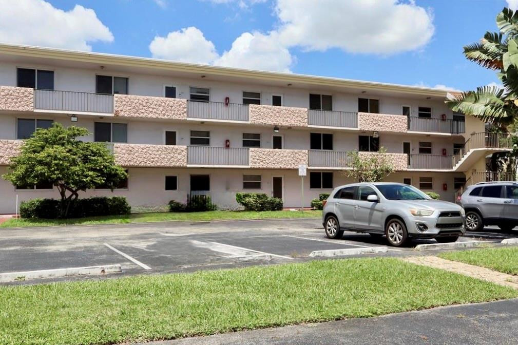 Updated corner condo with serene water views in the heart of Sunrise. This bright and spacious 2-bedroom, 2-bath home features impact windows and a split-bedroom layout ideal for guests or a home office. The kitchen offers a brand new stove and microwave, plus plenty of space to cook and entertain comfortably. Enjoy added peace of mind with a newer A/C (2022), updated electrical panel, and tankless water heater. Relax year round on the enclosed patio overlooking the water, the perfect spot for morning coffee or evening sunsets. Full-size washer and dryer in unit, plus convenient parking right outside your door. Located in the desirable 55+ community of Waterbridge, residents enjoy a pool, fitness center, tennis courts, and clubhouse. Conveniently close to shopping, dining, and highways.