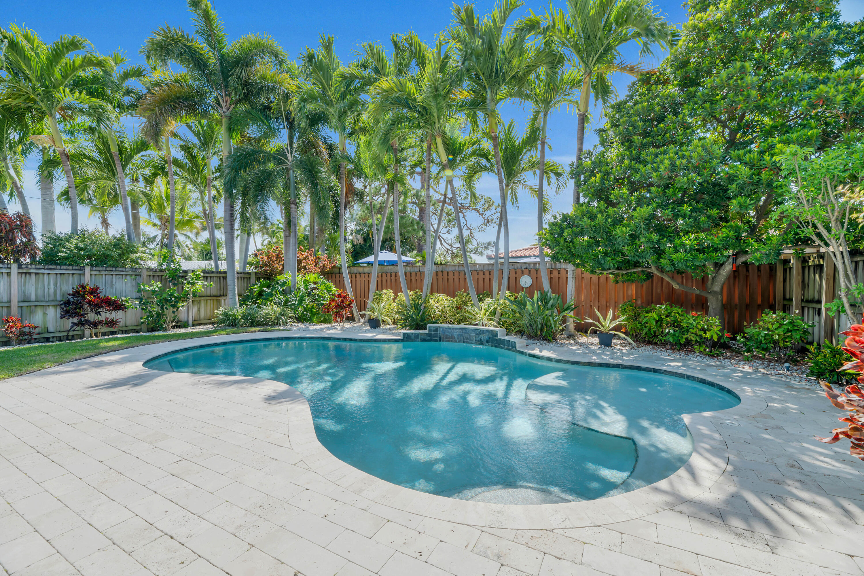 PRICE IMPROVEMENT! Private tropical retreat in the highly sought-after East Wilton Manors neighborhood. Beautifully maintained three-bedroom, two-bath home offers the perfect blend of comfort, style, and South Florida living. Bright and inviting interior with open, flowing layout designed for relaxing and entertaining. Restored terrazzo floors add timeless character and a touch of mid-century charm. Sparkling saltwater pool—perfect for cooling off on warm days or hosting gatherings. The home also features impact windows and doors. Lush, mature tropical landscaping, the backyard feels like your own secluded paradise. Additional highlights include a convenient garage for secure parking and a dedicated laundry room.  Ideally located just minutes from beaches, dining, shopping, and vibrant nightlife!