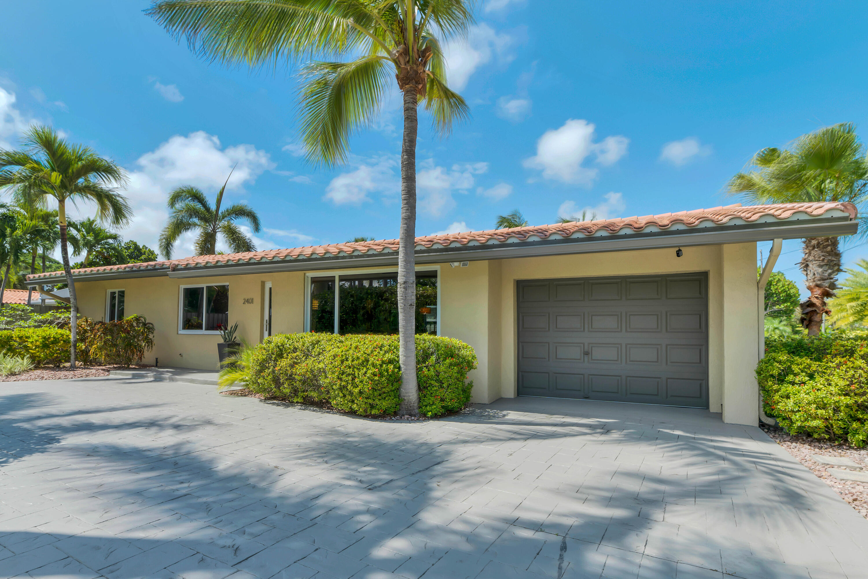 Private tropical retreat in the highly sought-after East Wilton Manors neighborhood. Beautifully maintained three-bedroom, two-bath home offers the perfect blend of comfort, style, and South Florida living. Bright and inviting interior with open, flowing layout designed for relaxing and entertaining. Restored terrazzo floors add timeless character and a touch of mid-century charm. Sparkling saltwater pool—perfect for cooling off on warm days or hosting gatherings. The home also features impact windows and doors. Lush, mature tropical landscaping, the backyard feels like your own secluded paradise. Additional highlights include a convenient garage for secure parking and a dedicated laundry room. Ideally located just minutes from beaches, dining, shopping, and vibrant nightlife!