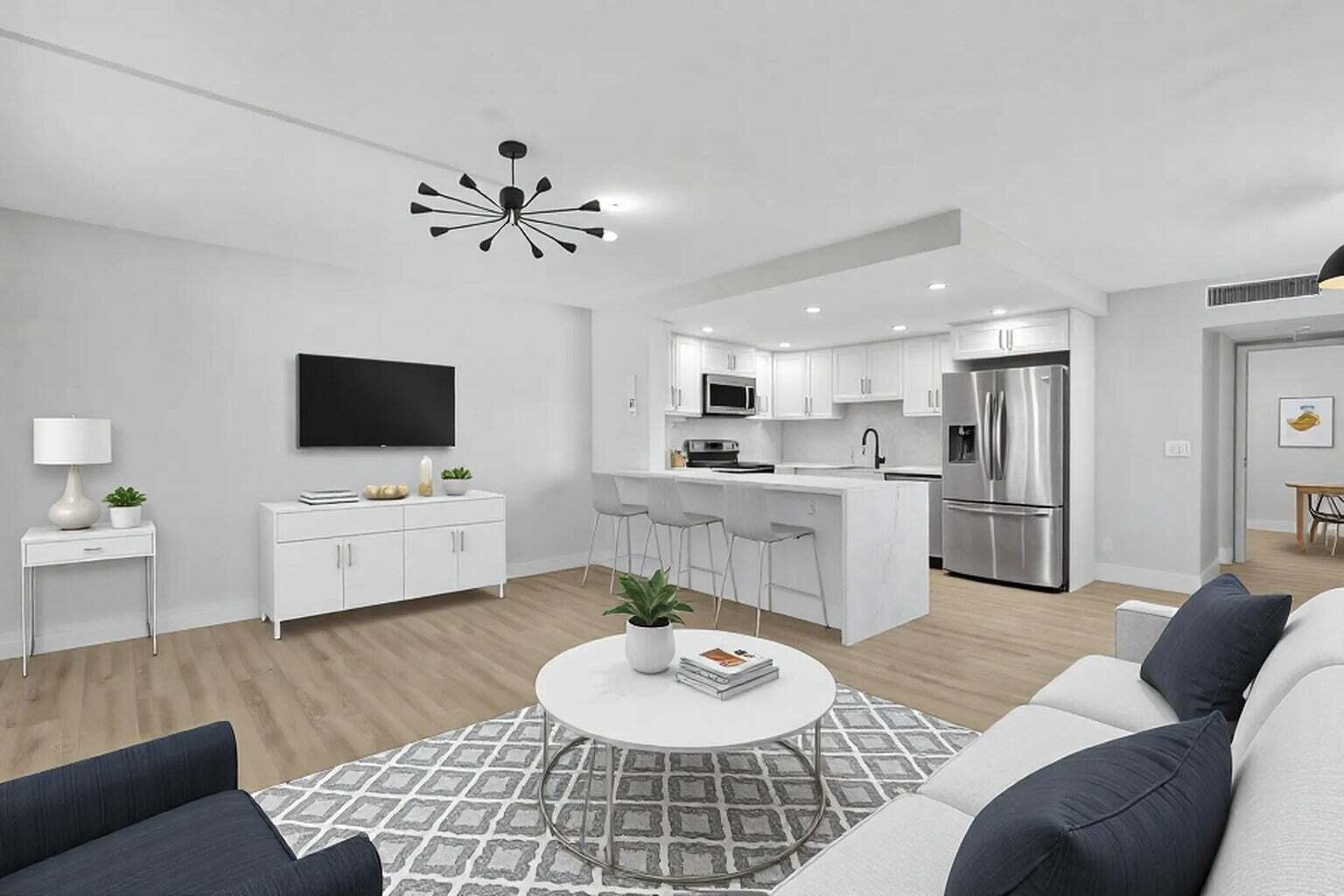 Just Listed! Stunning designer ground-floor 1-bedroom, 1.5-bathroom condo in the highly sought-after Kings Point Golf & Country Club, offering the perfect combination of modern luxury, comfort, and resort-style living. This beautifully renovated, move-in-ready home showcases exceptional craftsmanship and high-end finishes throughout, including a newer A/C, tankless water heater, and updated electrical panel for added peace of mind. Step inside to an inviting open-concept floor plan featuring waterproof laminate flooring throughout the living areas, creating a seamless flow that's perfect for everyday living and entertaining. The spectacular chef's kitchen is the centerpiece of the home, boasting a striking quartz waterfall countertop, matching quartz backsplash, premium Samsung stainless  steel appliances, custom cabinetry, and contemporary finishes that make every meal a pleasure. Every detail has been thoughtfully updated, including all-new designer light fixtures, modern switches, and beautifully remodeled bathrooms featuring elegant vanities, stylish mirrors, updated toilets, and sophisticated finishes. The spacious primary suite offers generous closet space with charming barn doors and a beautifully renovated en-suite bathroom complete with a fully tiled walk-in shower enclosed by sleek glass doors, creating a spa-like retreat. The enclosed patio provides additional living space to relax and unwind and includes a convenient utility closet with a full-size washer and dryer. Enjoy the unparalleled lifestyle that Kings Point is known for, with access to two championship 18-hole golf courses, indoor and outdoor swimming pools, tennis courts, pickleball, fitness centers, a stunning clubhouse, theater, café, bistro, card rooms, social clubs, and an endless calendar of activities designed to keep you active and entertained. Ideally located just minutes from vibrant Downtown Delray Beach, you'll enjoy easy access to award-winning restaurants, boutique shopping, art galleries, entertainment, and the beautiful white sandy beaches along Florida's Atlantic coast. Whether you're looking for a full-time residence or the perfect seasonal getaway, this exceptional home truly has it all. Don't miss this incredible opportunity to own a beautifully updated condo in one of South Florida's premier active lifestyle communities!