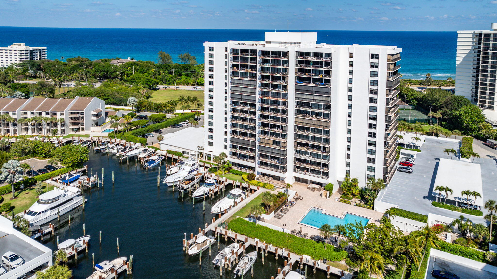 Dalton Place at Boca Highland Beach Club & Marina is a premier gated community with an ideal location close to Spanish River for easy access to Boca Raton, Delray Beach and Highland Beach Florida. Enjoy the best of both worlds whether you want to relax at the beach or boat down the Intracoastal to Lake Boca.  A tastefully updated PRIVATE BEACH CLUB with an oceanfront pool, barbecue area, sun deck, gas grill and picnic area, clubhouse with a gorgeous ocean view perfect for gatherings, kitchen and deeded beach access give you the club lifestyle without the membership fees. Enjoy a valet to take you to the beach club so you don't have to carry your items. At the Dalton there is also a marina, a secondary pool on the Intracoastal, sauna, fitness center, pickleball, fitness center, tennis, valet, security, on site management, and a large luxurious entertaining community room with bar and kitchen with Intracoastal views. The lobby and hallways have all been elegantly redone in this immaculate building. The building passed its' 40 year certification and has zero incoming assessments. This condo is in pristine condition so you can immediately enjoy the south Florida lifestyle. The large living area are filled with natural light and the sliders open to an expansive  covered balcony where you can easily fit outdoor furniture. The condo is spacious and with classic, refined finishes including electric blinds in each room. There is a large primary ensuite with bathroom and walk in closet. What you would love about this home is the ample storage you have in the unit, a pantry with pull out drawers and also a bonus storage unit right down the hall. All windows are impact and there are bonus shutters for your patio. When living here, you can actually see what your HOA offers you which is the resort lifestyle that allows you unwind, relax and enjoy the beach and ocean breezes.
