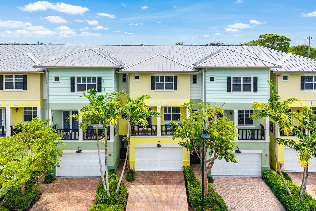 Perfectly positioned in East Delray Beach, this beautifully updated 4 bed, 3.5 bath townhome offers the ideal blend of space, convenience, and coastal living just minutes from the beach, Atlantic Avenue, and Mizner Park. Featuring one of the largest floor plans in the community, this three-story residence is one of only two homes with a private elevator. Upgrades include a renovated primary bath, 10-foot ceilings, hurricane-impact windows and doors, multiple private balconies, custom California Closets, and built-in storage throughout. The versatile layout offers a first-floor guest suite and opens to a private gated patio and garden with a mango tree. Complete with a 2-car garage, private driveway, clubhouse, pool, basketball court, putting green, and playground.