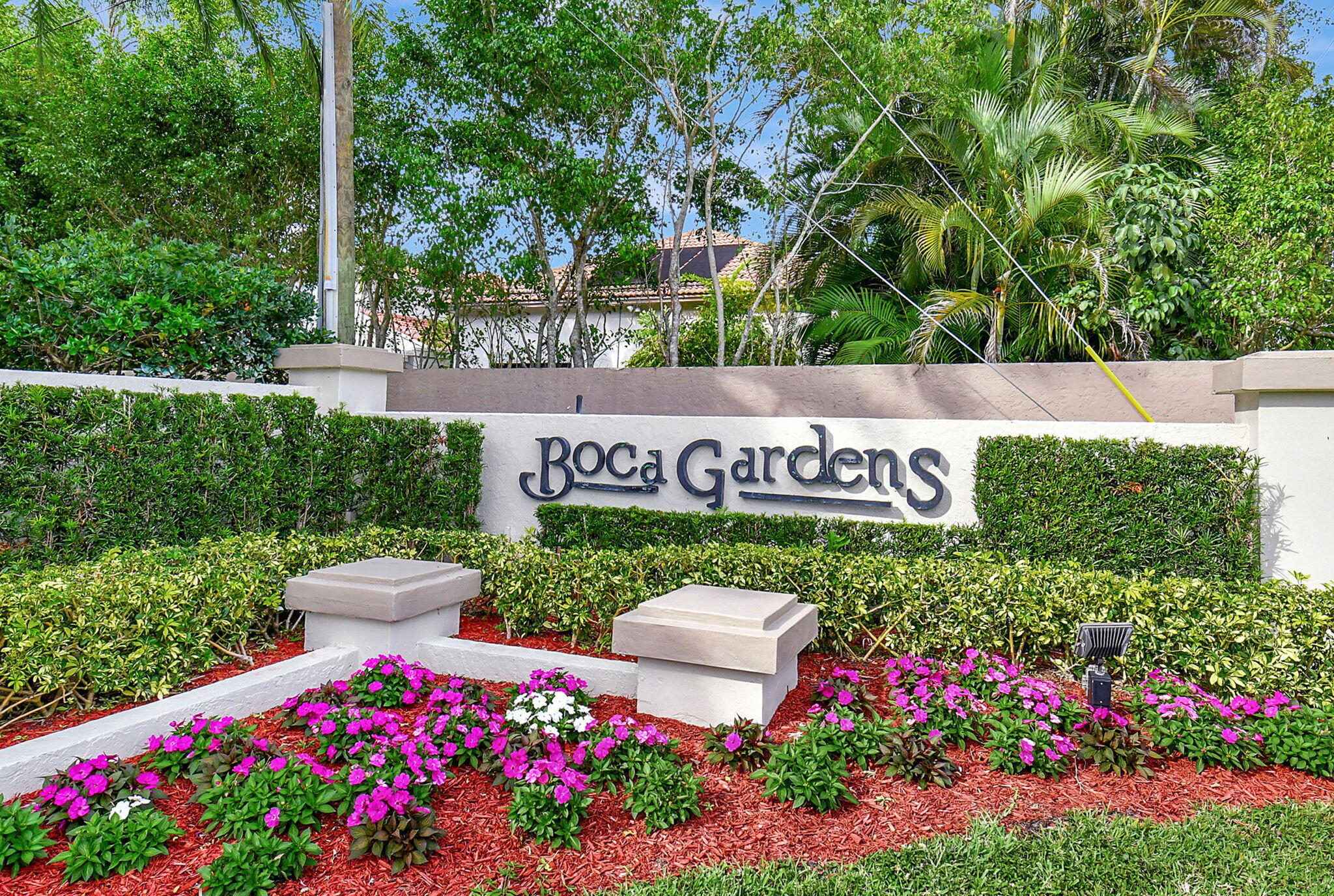Rare opportunity to own a private pool home in Boca Gardens. This move-in ready residence has been thoughtfully updated and offers a desirable combination of indoor comfort and outdoor living. The remodeled kitchen features stainless steel appliances, updated cabinetry, and ample workspace. New waterproof luxury vinyl plank flooring throughout the main living areas on the first floor creates a fresh, contemporary feel, while the renovated primary bathroom showcases updated fixtures and finishes. A newer air-conditioning system provides added peace of mind. The spacious layout is filled with natural light and flows seamlessly to the private outdoor retreat. Enjoy your own screened private pool area, offering space for relaxation, entertaining, outdoor dining, or simply enjoying Florid Florida living year-round. The flexible floor plan provides comfortable living spaces and generous room sizes, with thoughtful updates throughout that allow the next owner to move right in and begin enjoying the home immediately. Located within Boca Gardens, residents enjoy access to community amenities including swimming pools, tennis courts, basketball courts, playgrounds, walking paths, and clubhouse facilities. Conveniently situated near shopping, dining, parks, recreational opportunities, and major roadways. Updated kitchen, renovated primary bath, new waterproof luxury vinyl plank flooring, stainless steel appliances, a newer air-conditioning system, and a private pool make this a unique opportunity within the community.  enhanced by an HOA that covers roof maintenance and replacement, exterior maintenance, and cable. Boca Gardens residents enjoy an impressive collection of amenities, including three community pools, tennis and pickleball courts, basketball courts, a fitness center, clubhouse, playgrounds, and scenic walking paths amid lush landscaping. Conveniently located near top-rated schools, premier shopping, dining, parks, and major highways, this residence offers an exceptional Boca Raton lifestyle. Private pool homes with this level of privacy, thoughtful updates, and resort-style amenities are seldom available. Experience one of Boca Gardens' most desirable offerings.