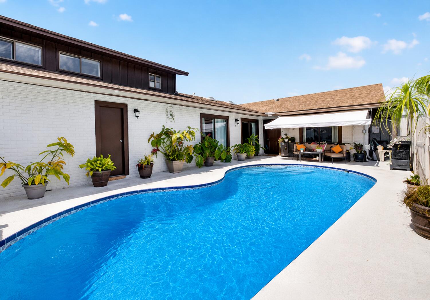 Rare opportunity to own a private pool home in Boca Gardens. This move-in ready residence has been thoughtfully updated and offers a desirable combination of indoor comfort and outdoor living. The remodeled kitchen features stainless steel appliances, updated cabinetry, and ample workspace. New waterproof luxury vinyl plank flooring throughout the main living areas on the first floor creates a fresh, contemporary feel, while the renovated primary bathroom showcases updated fixtures and finishes. A newer air-conditioning system provides added peace of mind. The spacious layout is filled with natural light and flows seamlessly to the private outdoor retreat. Enjoy your own screened private pool area, offering space for relaxation, entertaining, outdoor dining, or simply enjoying Florid Florida living year-round. The flexible floor plan provides comfortable living spaces and generous room sizes, with thoughtful updates throughout that allow the next owner to move right in and begin enjoying the home immediately. Located within Boca Gardens, residents enjoy access to community amenities including swimming pools, tennis courts, basketball courts, playgrounds, walking paths, and clubhouse facilities. Conveniently situated near shopping, dining, parks, recreational opportunities, and major roadways. Updated kitchen, renovated primary bath, new waterproof luxury vinyl plank flooring, stainless steel appliances, a newer air-conditioning system, and a private pool make this a unique opportunity within the community.  enhanced by an HOA that covers roof maintenance and replacement, exterior maintenance, and cable. Boca Gardens residents enjoy an impressive collection of amenities, including three community pools, tennis and pickleball courts, basketball courts, a fitness center, clubhouse, playgrounds, and scenic walking paths amid lush landscaping. Conveniently located near top-rated schools, premier shopping, dining, parks, and major highways, this residence offers an exceptional Boca Raton lifestyle. Private pool homes with this level of privacy, thoughtful updates, and resort-style amenities are seldom available. Experience one of Boca Gardens' most desirable offerings.
