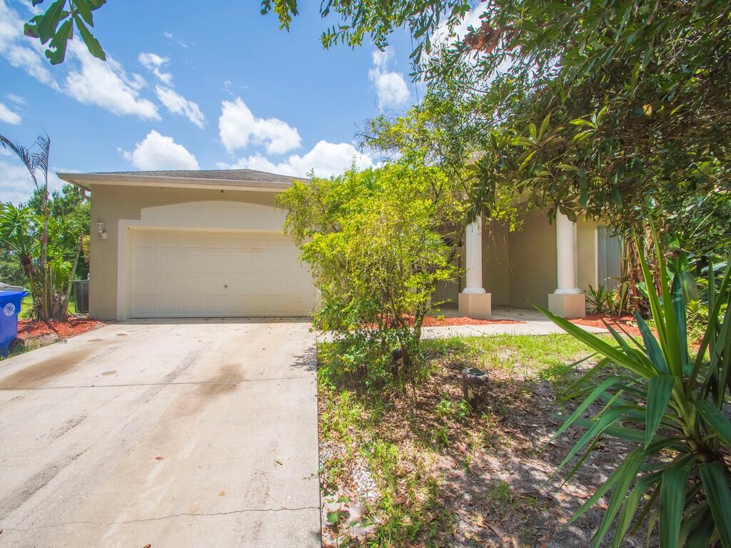 Welcome to your private oasis! This 5 bedroom 3 bathroom home that is situated on 2.08 acres, this spacious residence offers nearly 3,800 square feet of living space and endless possibilities. The expansive property provides ample room to add a pool, gazebo, tiki bar, or outdoor entertainment area. The primary suite features an approximately 156-square-foot sitting room that could be transformed into an impressive walk-in closet. Two generously sized guest bedrooms—approximately 360 and 323 square feet—offer excellent flexibility for multigenerational living, home offices, or private retreats. Designed for gathering, the nearly 400-square-foot kitchen complements the spacious living room, family room, and formal dining area. A screened porch with three interior access points extends  the living space outdoors. This exceptional blank canvas is ready to be personalized and transformed into your dream home.