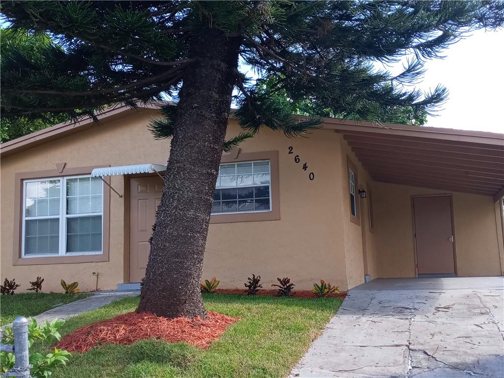 3 bedroom, 1 bath that just just been remodeled by owner to include, new roof, white modern kitchen, newer appliances, water heater, A/C  & new carpeting along with being freshly painted. Newer windows but not impact. Ready for move in. Lot is raised above street level as well as several on that side of street. Covered car port has a utility room with water heater & potential for washer/dryer. Large back yard with mature shade tree. Yard is fenced.