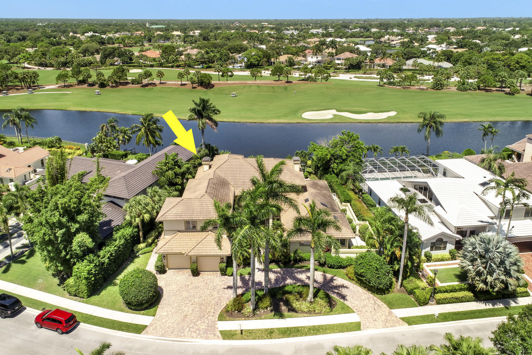 Luxury living in this 4 bedroom, 6 bathroom estate home offering breathtaking waterfront and golf course views.  Renovated with exceptional craftsmanship, this home features soaring volume ceilings, rich millwork, stone fireplace, impact windows and doors and a private elevator.   Chef's gourmet kitchen boasts a gas range, two sinks, wall oven, warming drawer, wine refrigerator ideal to entertain. The first floor primary bedroom suite offers his and hers bathrooms and his and hers walk in closets. Upstairs, enjoy an impressive home theater, wet bar with wine refrigerator, private balcony showcasing spectacular sunsets, lake and golf course views.  Two oversized additional ensuite bedrooms await the perfect homeowner.  Resort style pool overlook the Jack Nicklaus golf course.   Located within The Loxahatchee Club, one of America's Top 100 Platinum Clubs, residents enjoy an exclusive lifestyle with championship golf, world-class amenities, exceptional dining, tennis, pickleball, fitness, and unparalleled service. This extraordinary estate offers the ultimate combination of elegance, privacy, luxury, and South Florida country club living.  Jupiter boasts top rated schools, fantastic shopping and dining, beautiful beaches, boating and fishing, marinas. and a short drive to the Palm Beach International airport and Briteline.