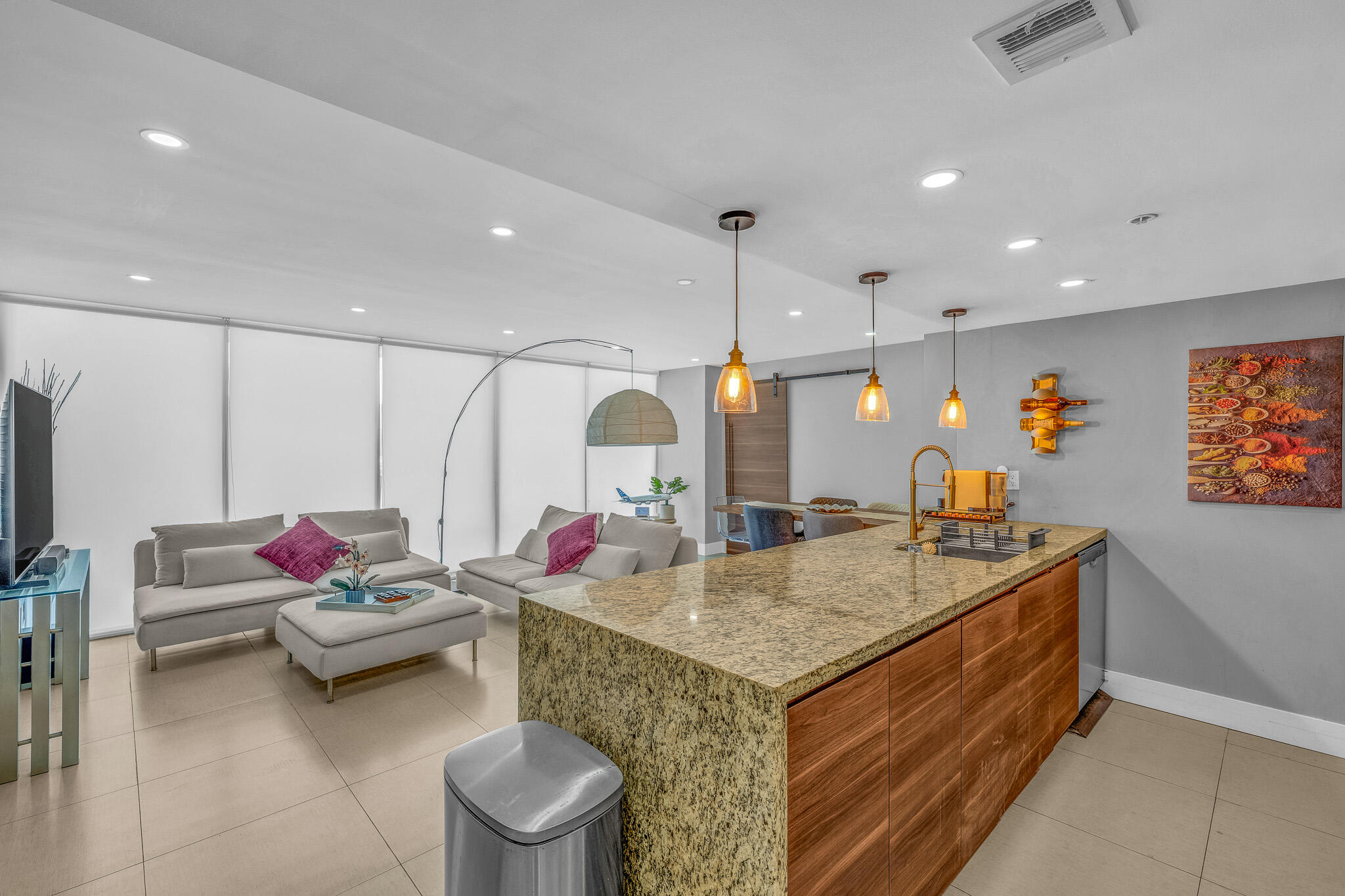 Live the waterfront lifestyle in this beautifully renovated 2BD/2BA condo in North Bay Village! Bright and spacious split floor plan with floor-to-ceiling windows, Italian porcelain floors, accent walls, barn doors, custom closets, and an oversized balcony accessible from both bedrooms. Modern open kitchen features granite countertops and stainless-steel appliances. Primary suite offers a walk-in closet and en-suite bath. In-unit washer and dryer, ample storage, and assigned parking included. Enjoy resort-style amenities: 24-hour security, attended lobby, Olympic-size pool, Jacuzzi, marina, fitness center, clubhouse, convenience store, salon, restaurants, and visitor parking. Prime location just minutes from Miami Beach, Wynwood, Midtown, Downtown, Bal Harbour, Aventura Mall, major highway