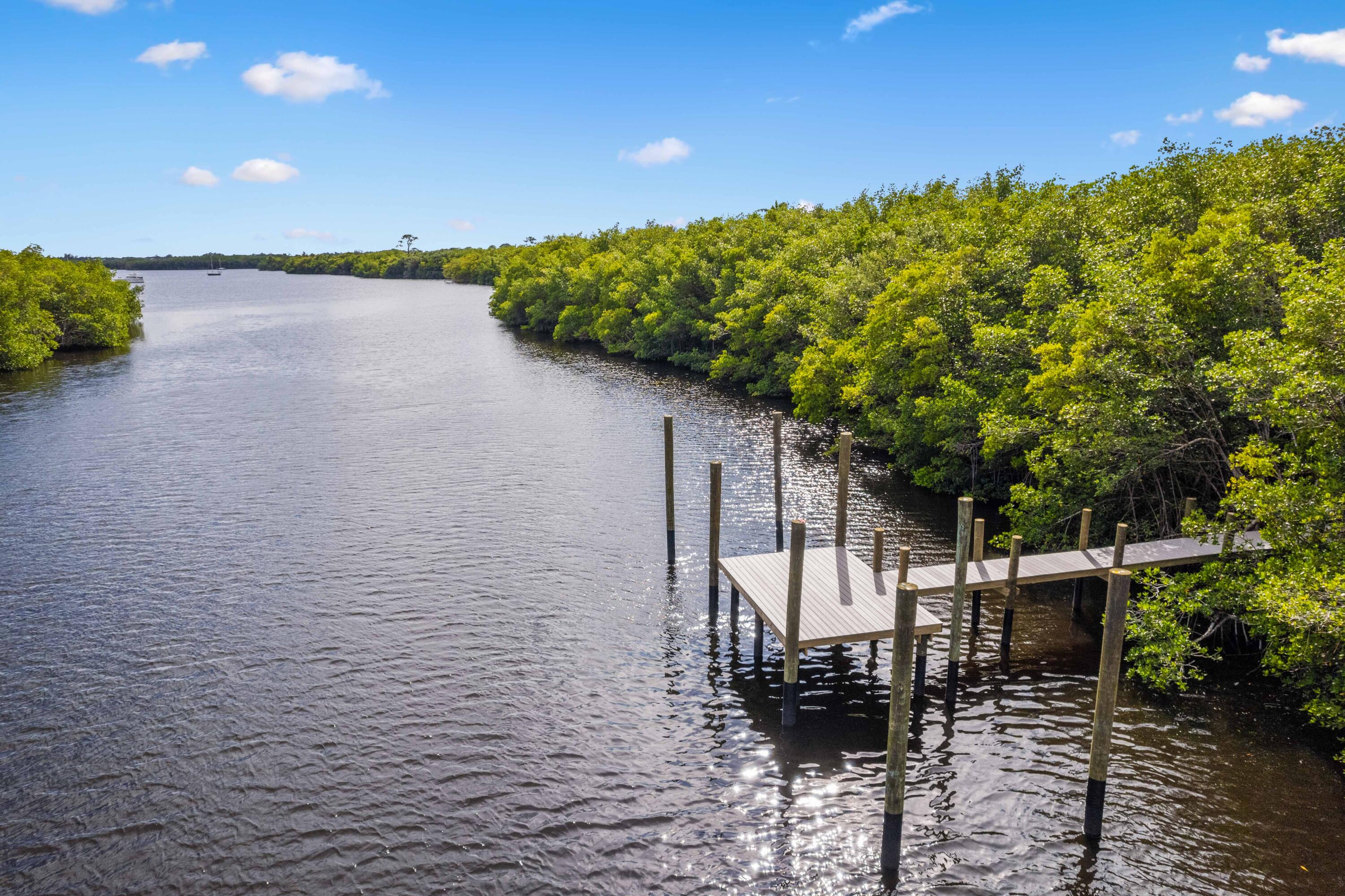 A BOATERS & FISHING ENTHUSIAST DREAM WATERFRONT LOT WITH A TWO BOAT SLIPS DOCK, BOARDWALK IS 310' X 4' BUILT IN 2024 LOCATED ON THE SAINT LUCIE RIVER, NO FIX BRIDGES, 25 MINUTES TO OCEAN. ADJACENT LOT IS AVAILABLE FOR SALE  IN CASE YOU WANT TO COMBINE BOTH LOTS TO BUILD A LARGER HOME, THAT WILL MAKE IT 0.68 OF AN ACRE. DOCK IS SURROUNDED BY PROTECTED WETLANDS, A NATURE'S SANCTUARY. LOCATED IN THE PRIVATE DOUBLE GATED PRIVATE ISLAND OF RAVELLO COMMUNITY. CLUBHOUSE, POOL, TENNIS COURT, TRAILS, KAYAKING, GOLF COURSES NEARBY.  CLOSE TO BEACHES, RESTAURANTS, SHOPPING, MEDICAL FACILITIES.
