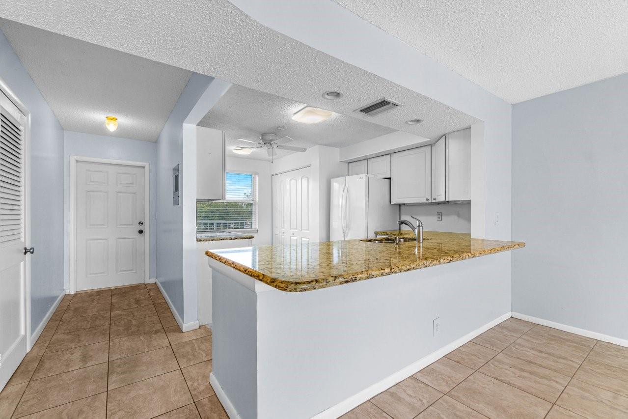Milestone structural building safety & reserve inspections completed and seller will payoff assessment. This simply fabulous update condo allows for Beautiful and Serene views of the water, golf course and cypress trees via impact windows/doors. The fresh and light interior features an open design, crisp white kitchen with granite counters, updated bathrooms, split floorplan, spacious primary suite, neutral tile throughout and a large inviting screened porch to enjoy stunning sunrises over the water & golf course. The unit is close to the elevator and is just a short walk to the clubhouse and pool. Although the community is tucked away on a quiet street, it has a super convenient location! Shopping, dining, places of worship, health care & entertainment are an easy short drive away.