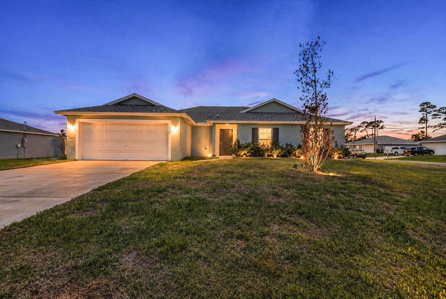 Welcome to this beautifully built 2023 CBS home offering modern comfort and an open-concept design in Port St. Lucie. This well-maintained property features tile flooring throughout the main living areas and a bright kitchen with beautiful countertops, ample cabinetry, and an island overlooking the living and dining spaces.  The split-bedroom floor plan provides added privacy, with a spacious primary suite featuring a walk-in closet and en-suite bath. Additional bedrooms offer flexibility for guests, office space, or family.  Enjoy the benefits of newer construction including energy-efficient systems, a 2-car garage, and impact resistant