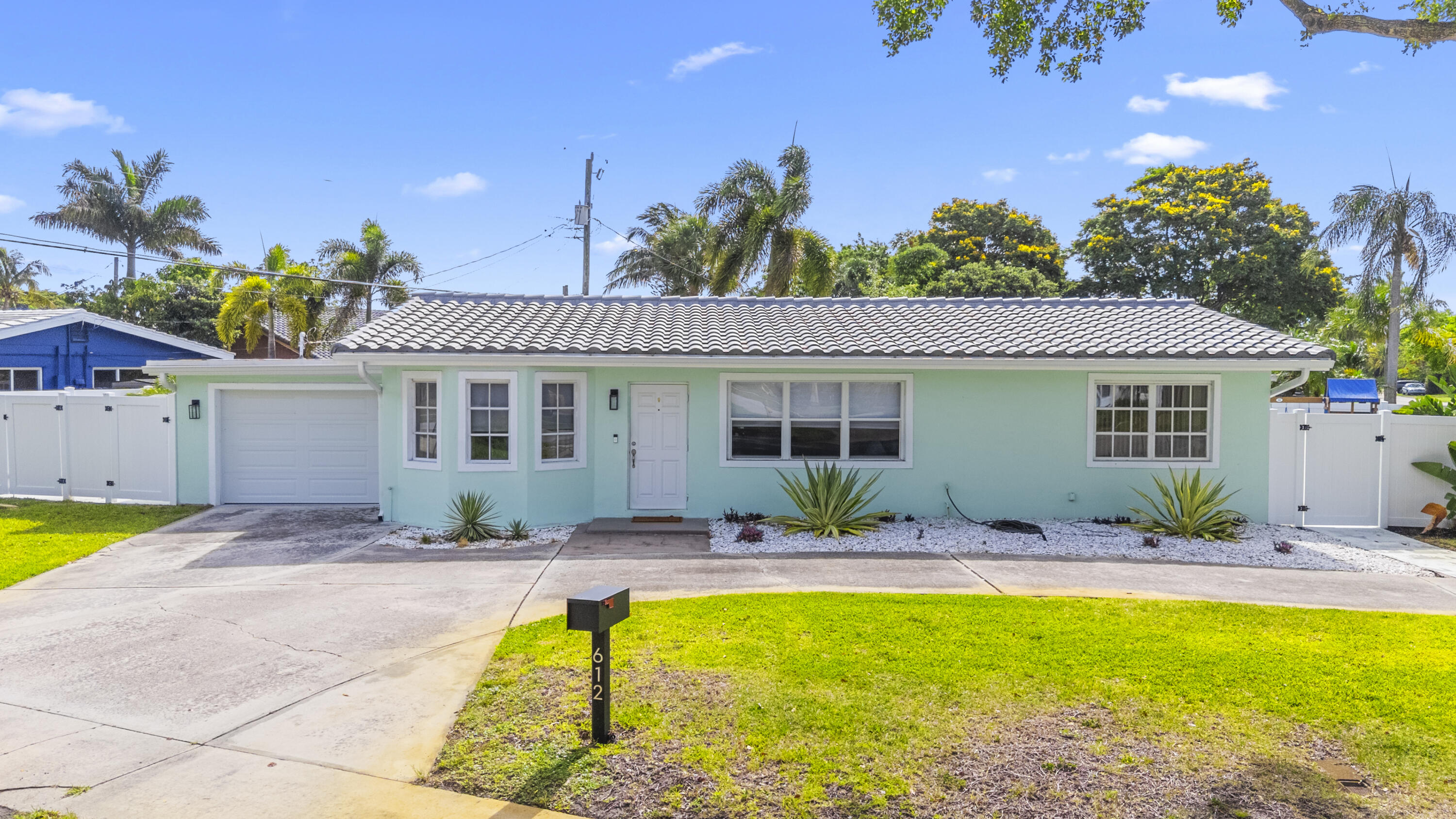 Rare corner lot three bedroom two bath with garage east of US one and desirable beach community of the cove. New roof, kitchen, baths, A/C, Pergola, fence, paver patio, artificial turf. Ride your bike to the beach from this Florida charming coastal cottage separate dining in kitchen laundry room one car garage for all your toys updated everywhere.